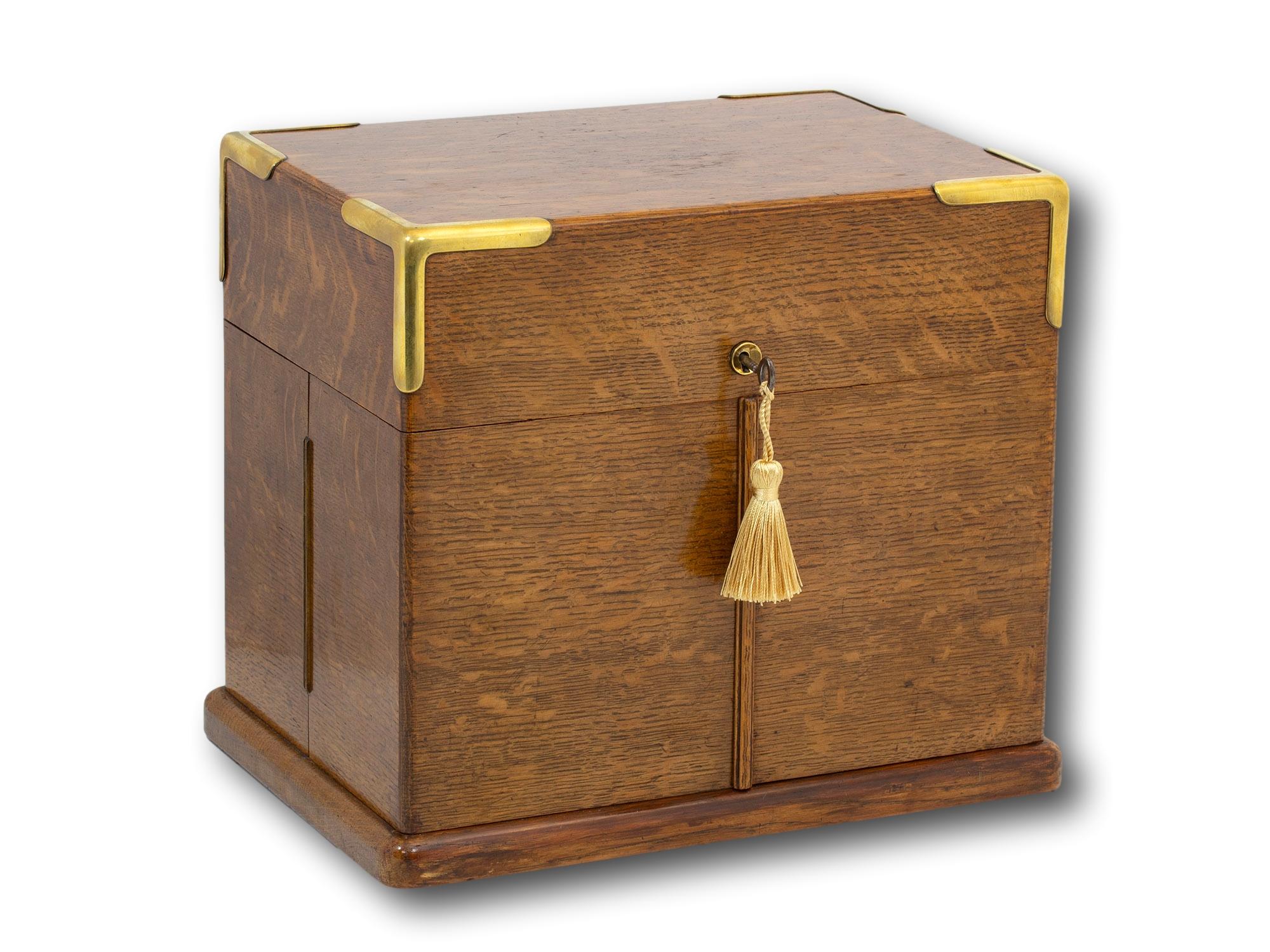 With Brass Tray

From our Decanter collection, we are delighted to offer this Victorian Oak Decanter Box. The Decanter Box of rectangular form made from oak with brass stood upon a stepped plinth base with corner mounts and a circular brass