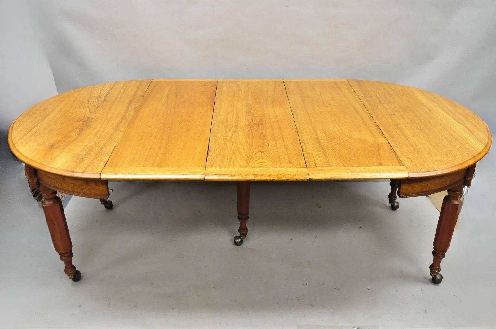 Ancienne table de salle à manger à rallonge en chêne et bois d'orme anglais victorien avec 3 abattants en vente 3