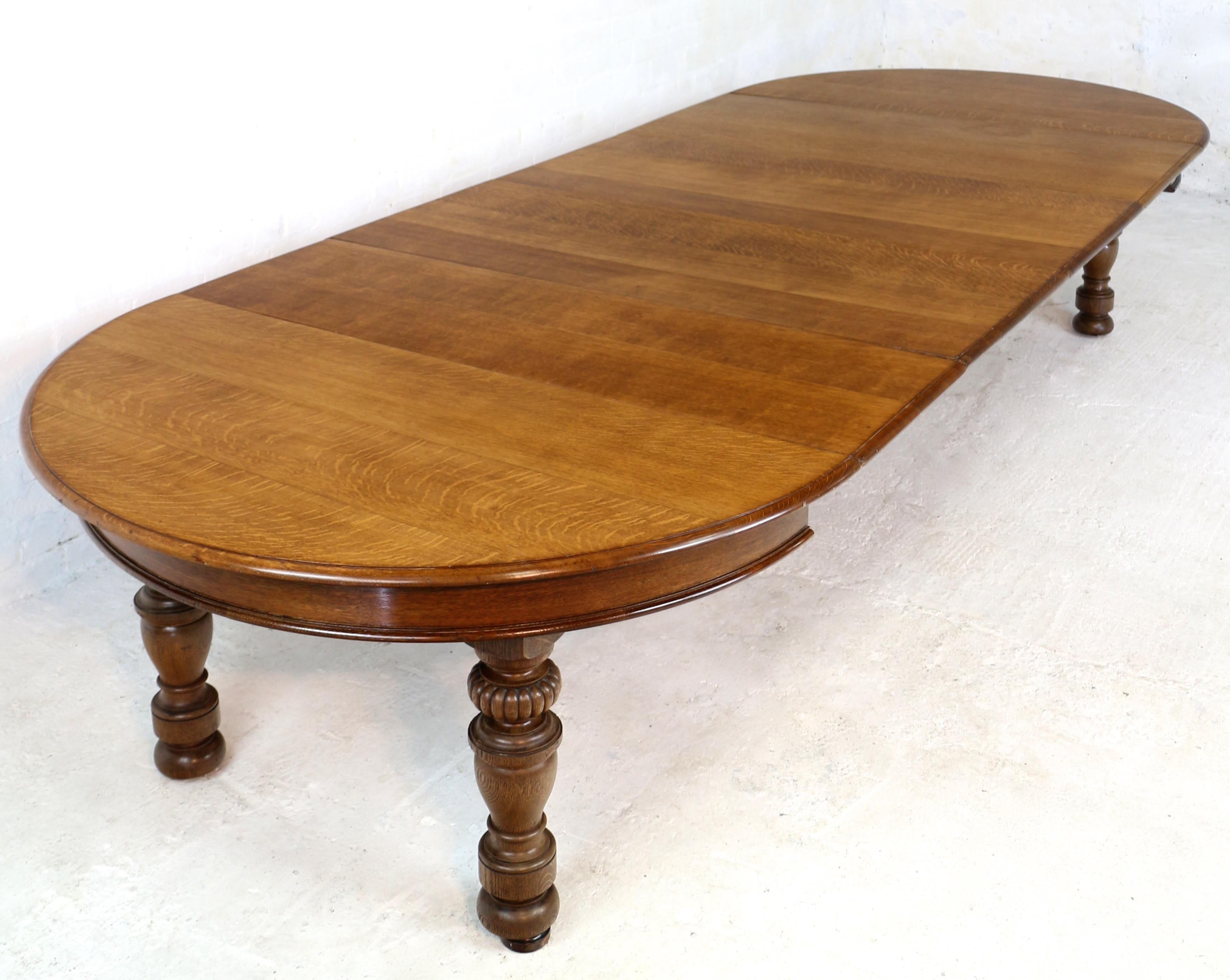 A substantial and extremely well made antique Victorian extending circular dining table made by Gillows of Lancaster. In quarter-sawn oak and with four leaves, this large 5ft round table extends by means of two runner systems to just over 12ft 6