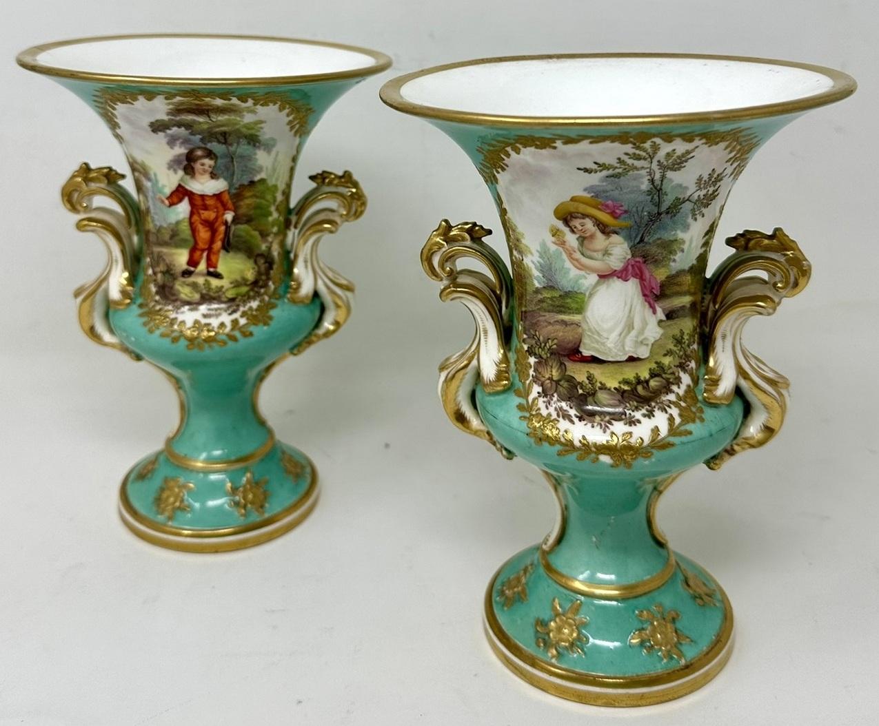 Wonderful Identical Pair of Early English Porcelain China Flared Rim Campagne form Urns with very ornate gilt twin handles modelled in the Rococo taste, firmly attributed to Coalport and painted by artist John Randall. Mid to late Nineteenth
