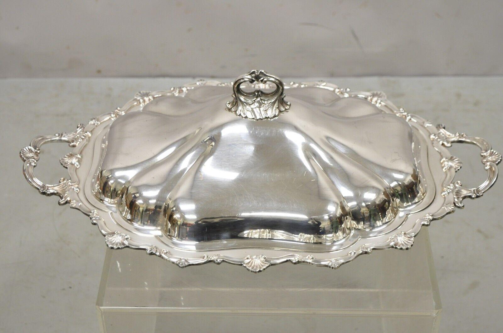 Antique English Victorian silver plate plidded serving tureen platter dish. Item features raised on ball form feet, ornate scalloped form, fancy lid and handle, very nice antique item, quality craftsmanship, great style and form. circa Early to