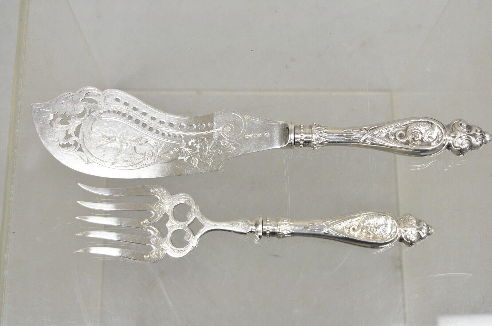 Antique English Victorian Silver Plated Figural Fish Service Fork Knife Set. Item features Cherub and dolphin design to handles, pierced and decorated knife, original hallmark which reads 