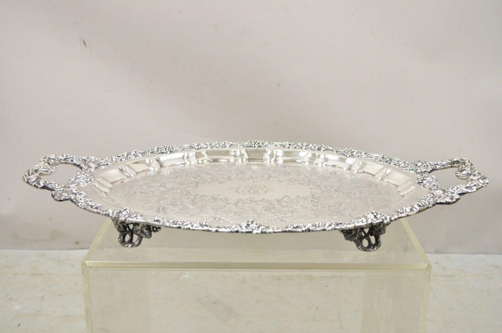 Antique English Victorian Silver Plated Ornate Grapevine Serving Platter Tray. Item features an engraved monogram to center, highly decorated throughout, ornate twin handles, raised on ornate feet, very nice antique item, quality craftsmanship,