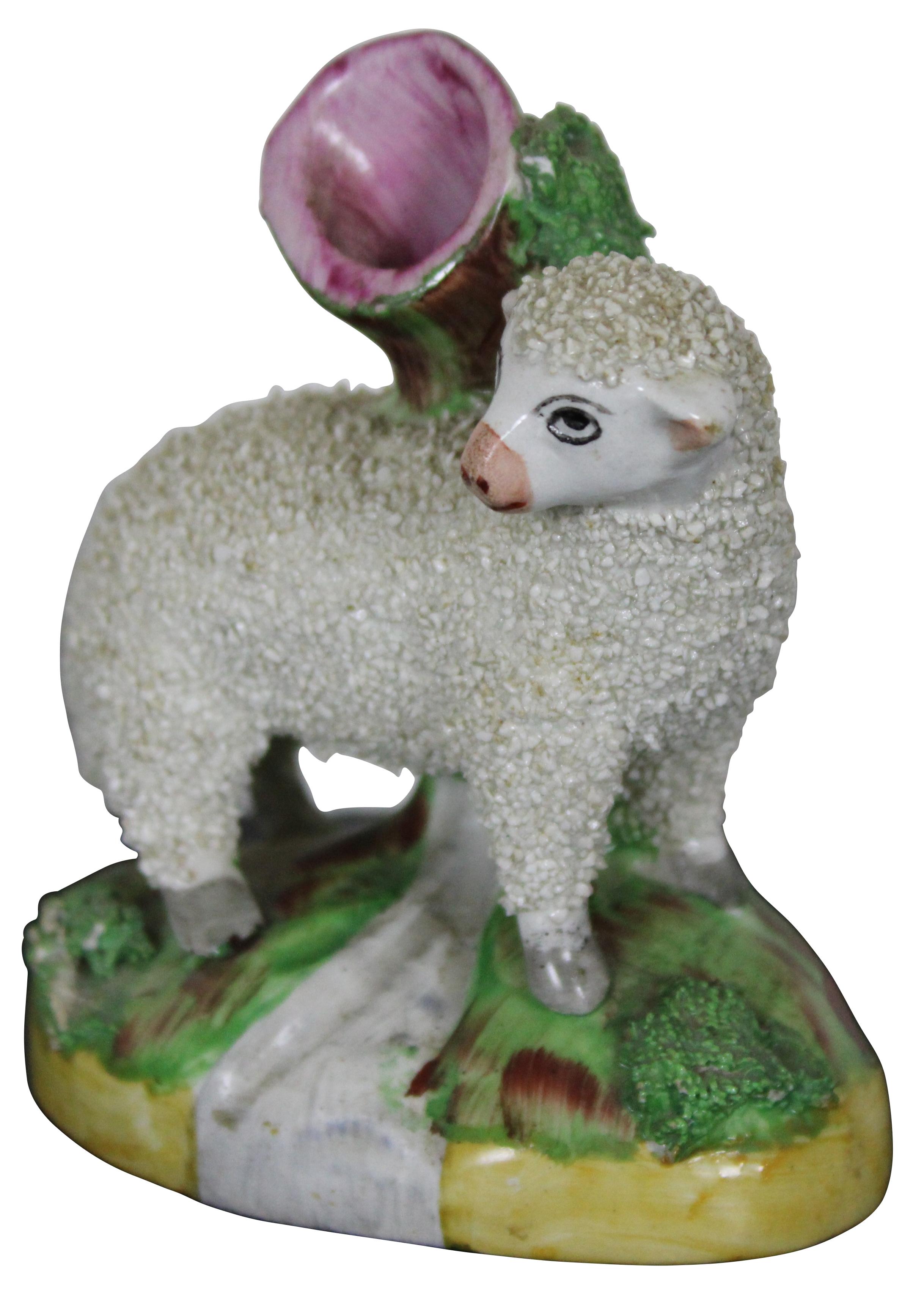 Small antique Victorian Staffordshireware spill or bud vase featuring a confetti porcelain lamb or sheep.