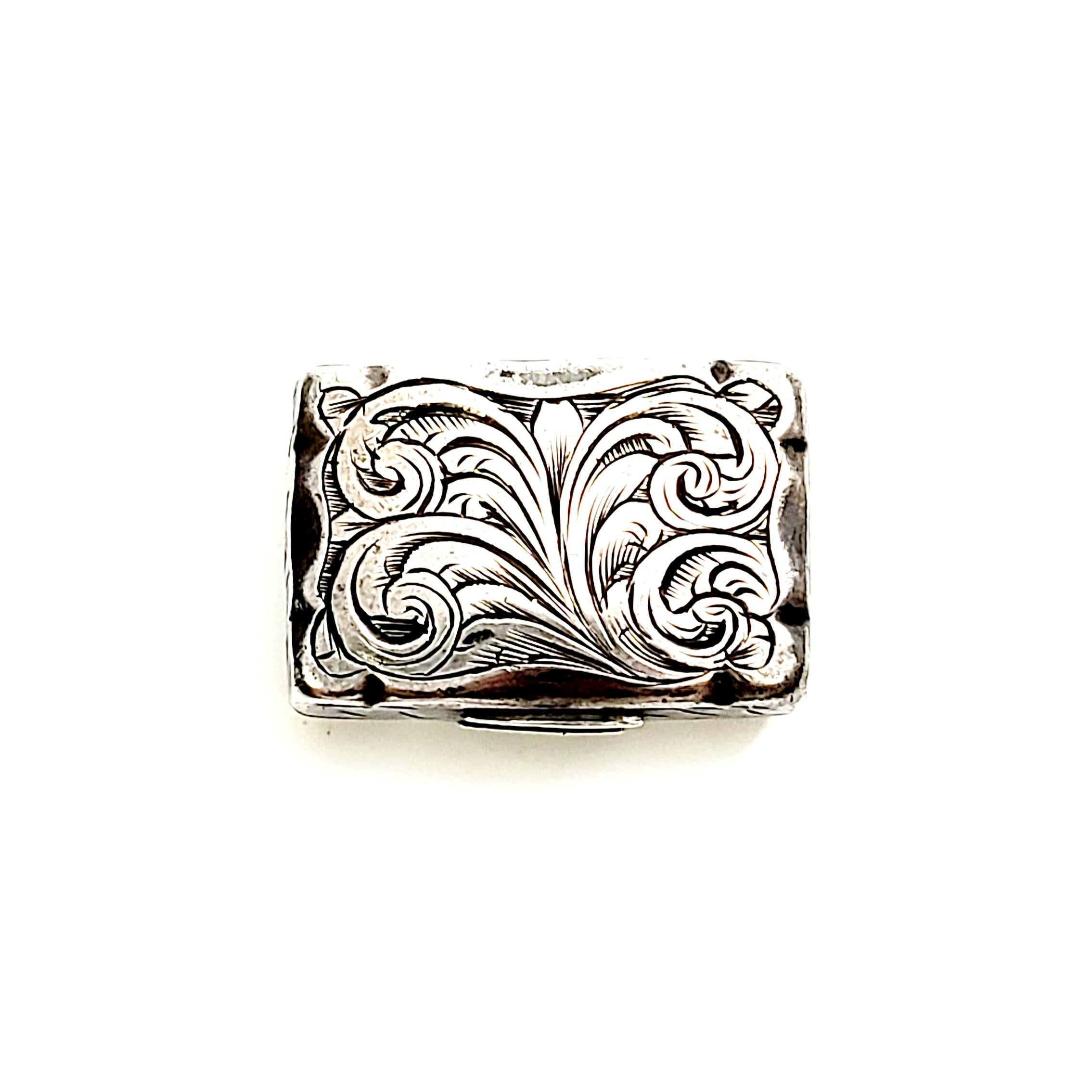 Antique English sterling silver vinaigrette box by Fredrick Marson, circa 1856.

This is a beautiful example of the small decorative boxes that were used to carry perfume and scents when traveling. The scent would be soaked into a sponge that