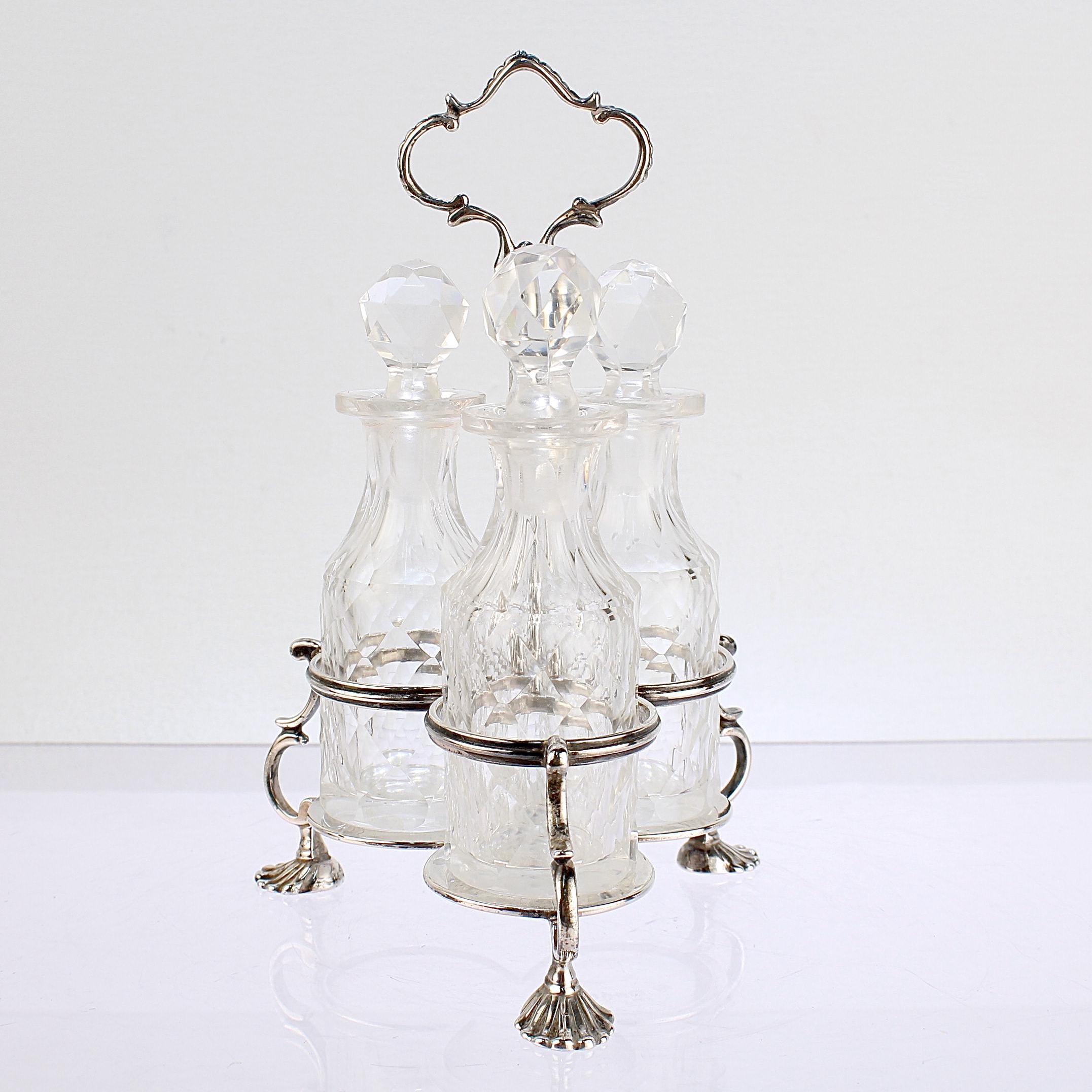 A fine antique Victorian cruet set.

Made George John Richards & Edward Charles Brown of London, England. 

Comprising of a sterling silver stand with 3 small cut glass cruet bottles. 

Marked for 1866.

Simply a wonderful example of Victorian