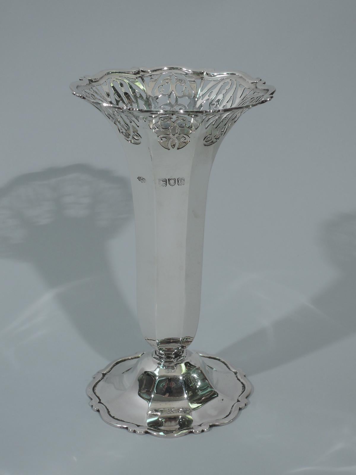 Victorian sterling silver vase. Made by Charles Clement Pilling–Sibray Hall & Co. in London in 1900. Faceted body on raised and faceted foot. Scrolls applied to rim and foot rim. Pierced scrolls and flowers. Hallmarked. Design number 354771