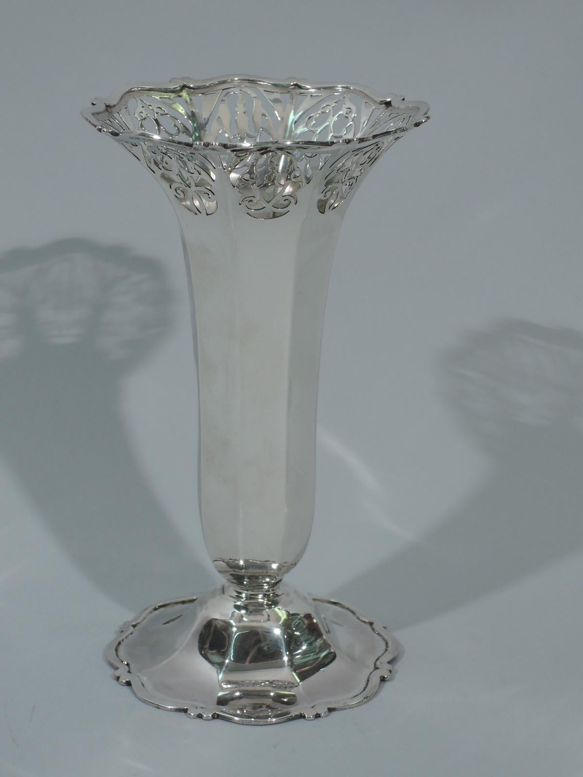 Victorian sterling silver vase. Made by Charles Clement Pilling–Sibray Hall & Co. in London in 1901. Faceted body on raised and faceted foot. Scrolls applied to rim and foot rim. Pierced scrolls and flowers. Hallmarked. Design number 354771