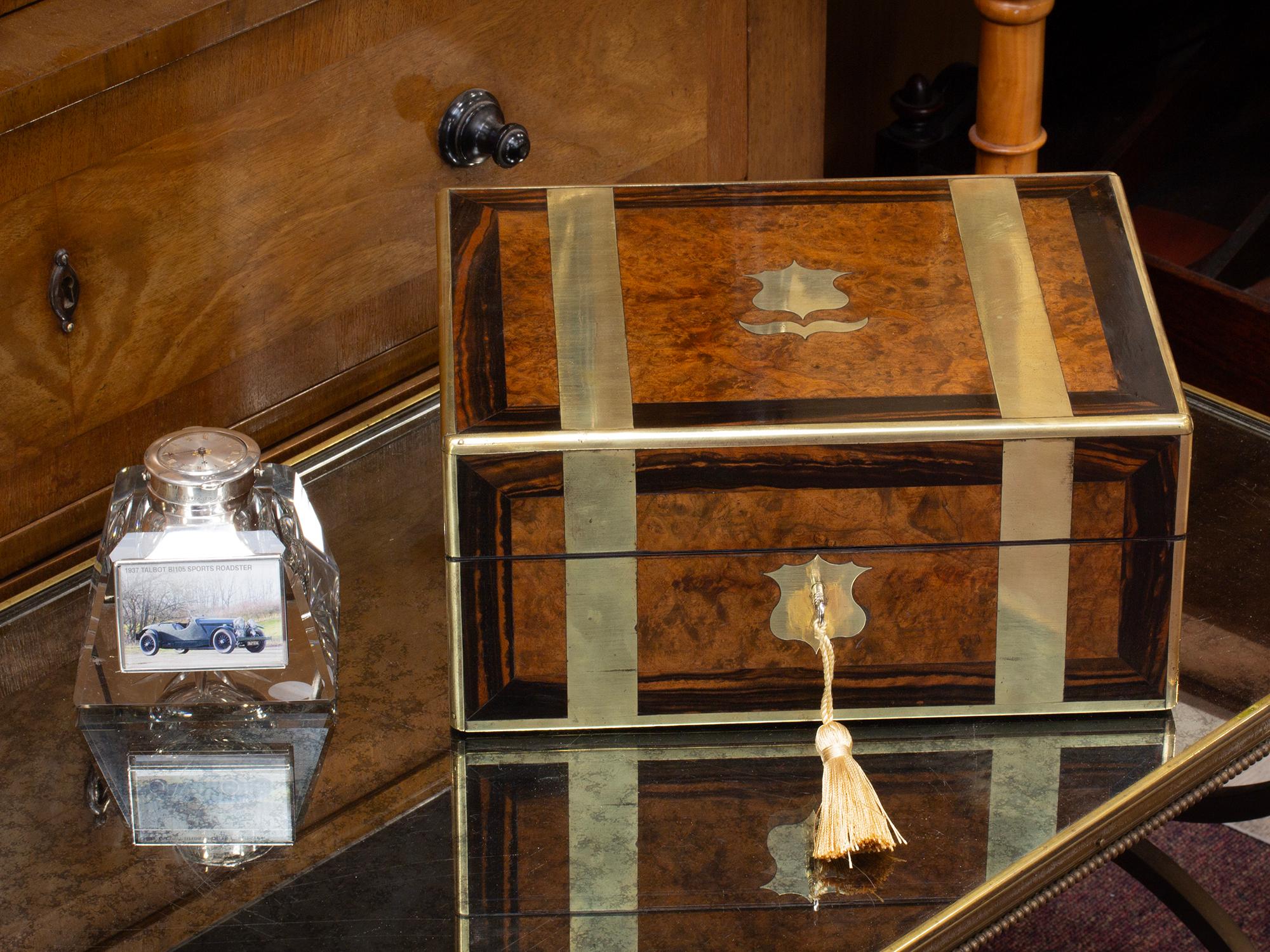 Brass Strapped Exterior

From our Jewellery Box collection, we are pleased to offer this Antique Victorian Jewellery Box. The Jewellery Box of rectangular form edged in brass and made from Mahogany is veneered to the lid and front with Walnut which