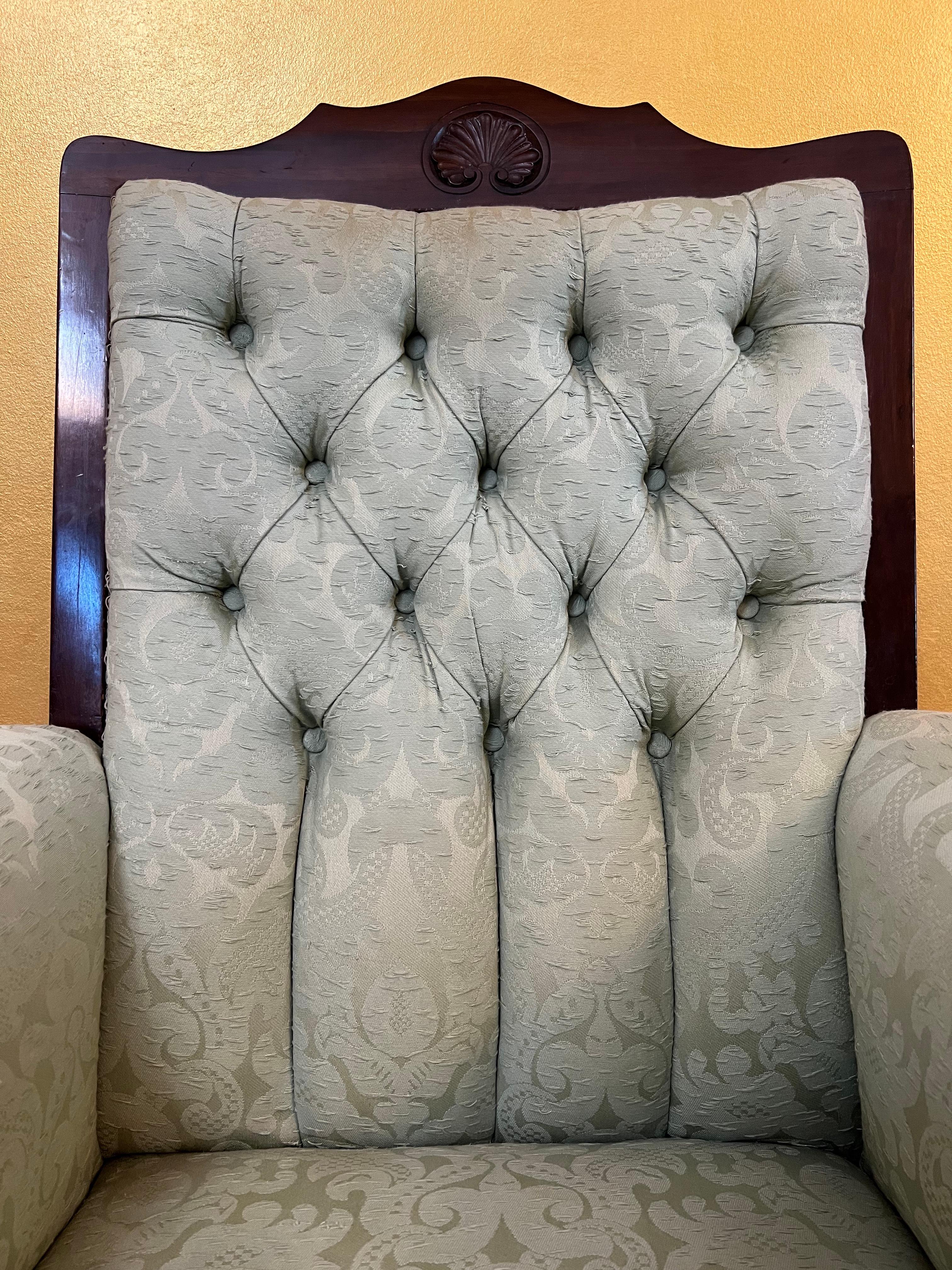 Button back mint colour damask fabric armchair, wooden detail around the front and back, has 4 castors, great for the living room or bedroom.

Circa: 1900

Material: Walnut

Country Of Origin: England

Measurements: 130cm high, 73cm length, 65cm