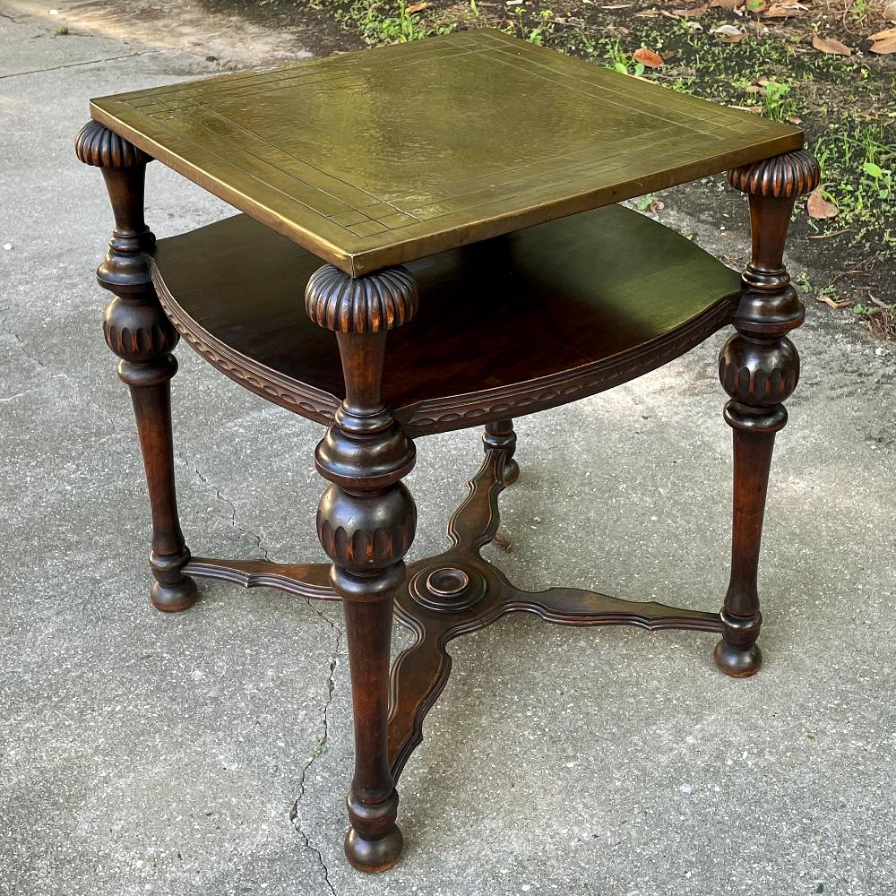 Antique English walnut end table with brass top is a visually interesting design, with a square top covered with hammered and engraved brass creating a 24