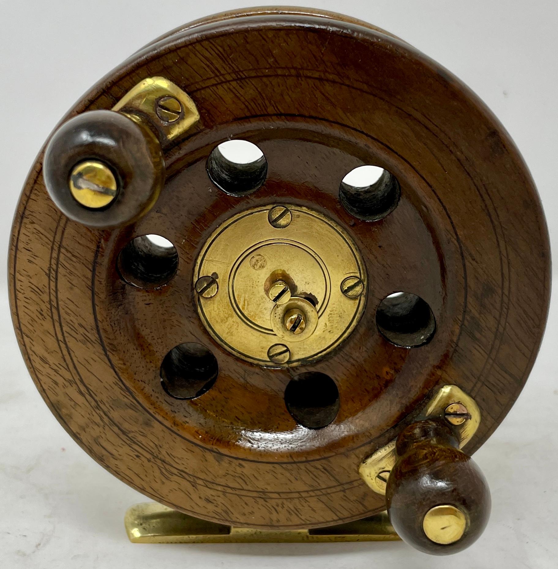 Antique English walnut fly fishing wheel with brass mounts, circa 1890-1900.