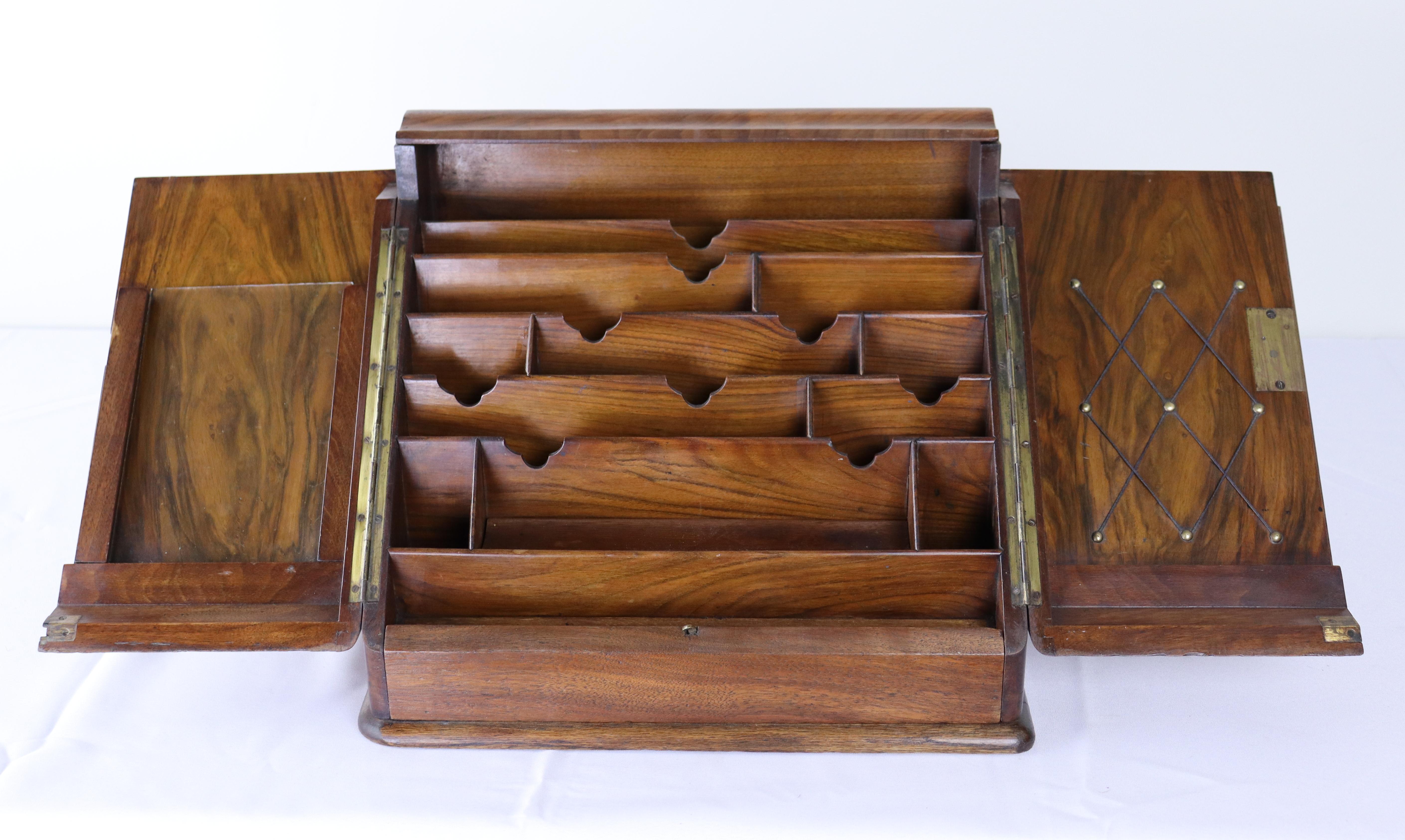 An antique English letters cabinet or rack, or home office desk organizer.  Fashioned in gorgeous walnut with good grain and patina.  Small drawer at the base adds to the utlity of the piece, which has three separate areas for organizing paperwork. 