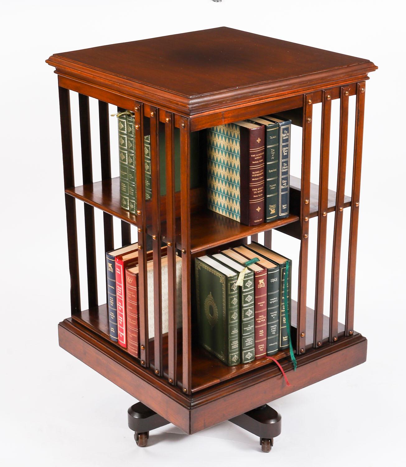 This an exquisite antique revolving bookcase, attributed to the renowned Victorian retailer and manufacturer Maple & Co., circa 1900 in date.

It is made of solid walnut and revolves on a solid cast iron base, the best quality  revolving bookcases
