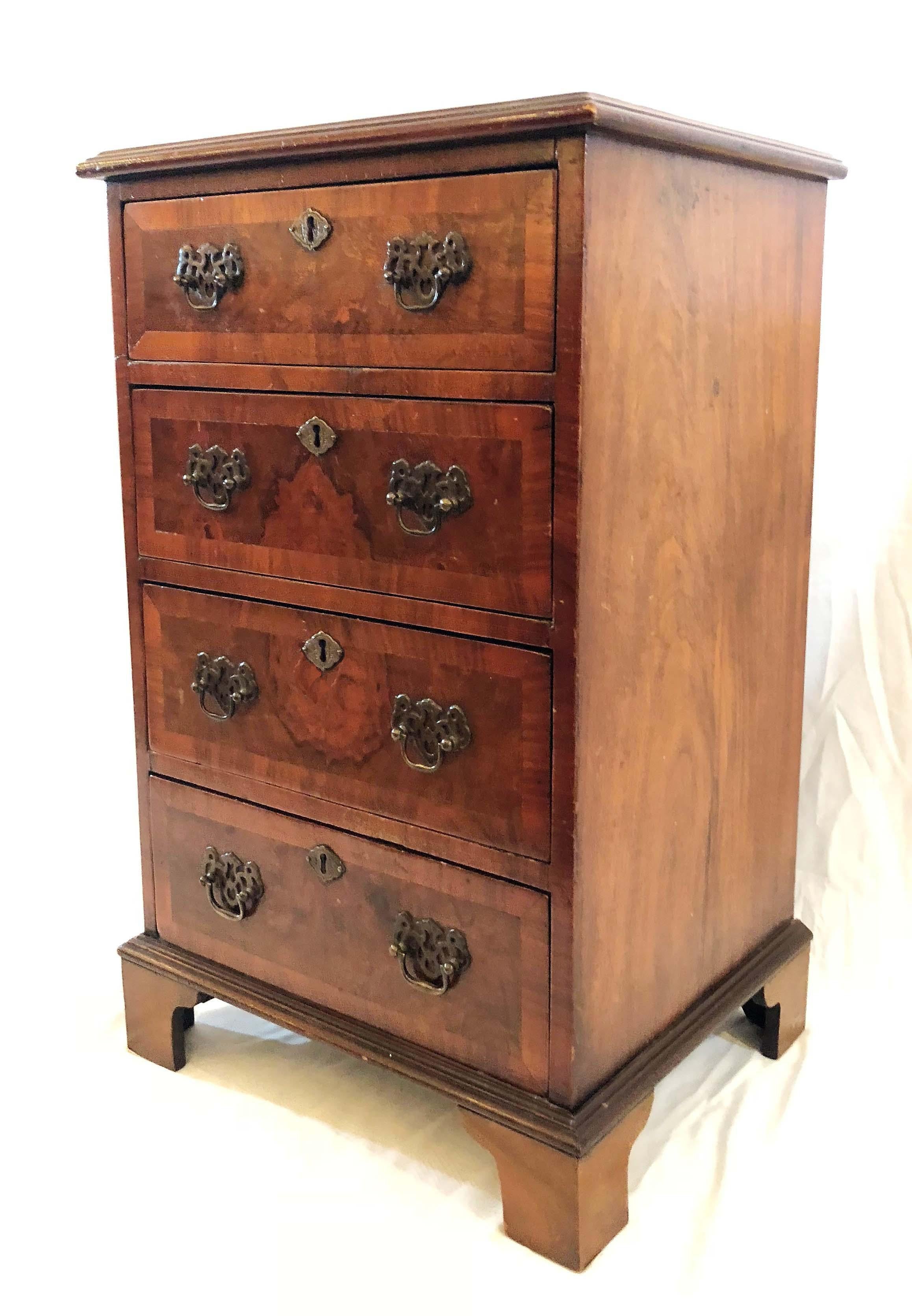 Antique English walnut small chest of drawers.