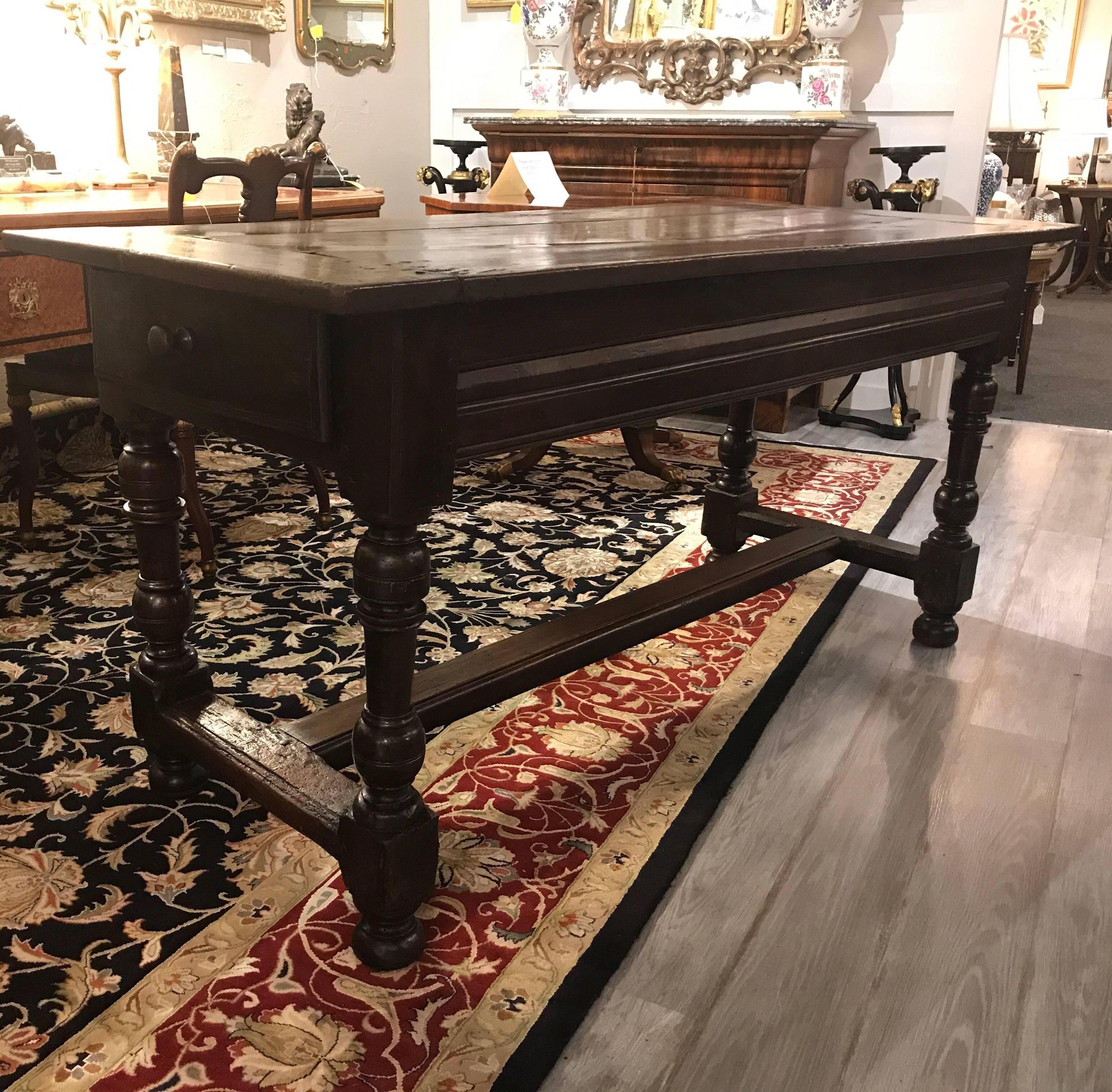 Handsome solid walnut late 18th-early 19th century tavern table, England, circa 1800. The table is in well carved for condition with a recent polish. The warm aged patination that can only come with hundreds of years of age. The table has two