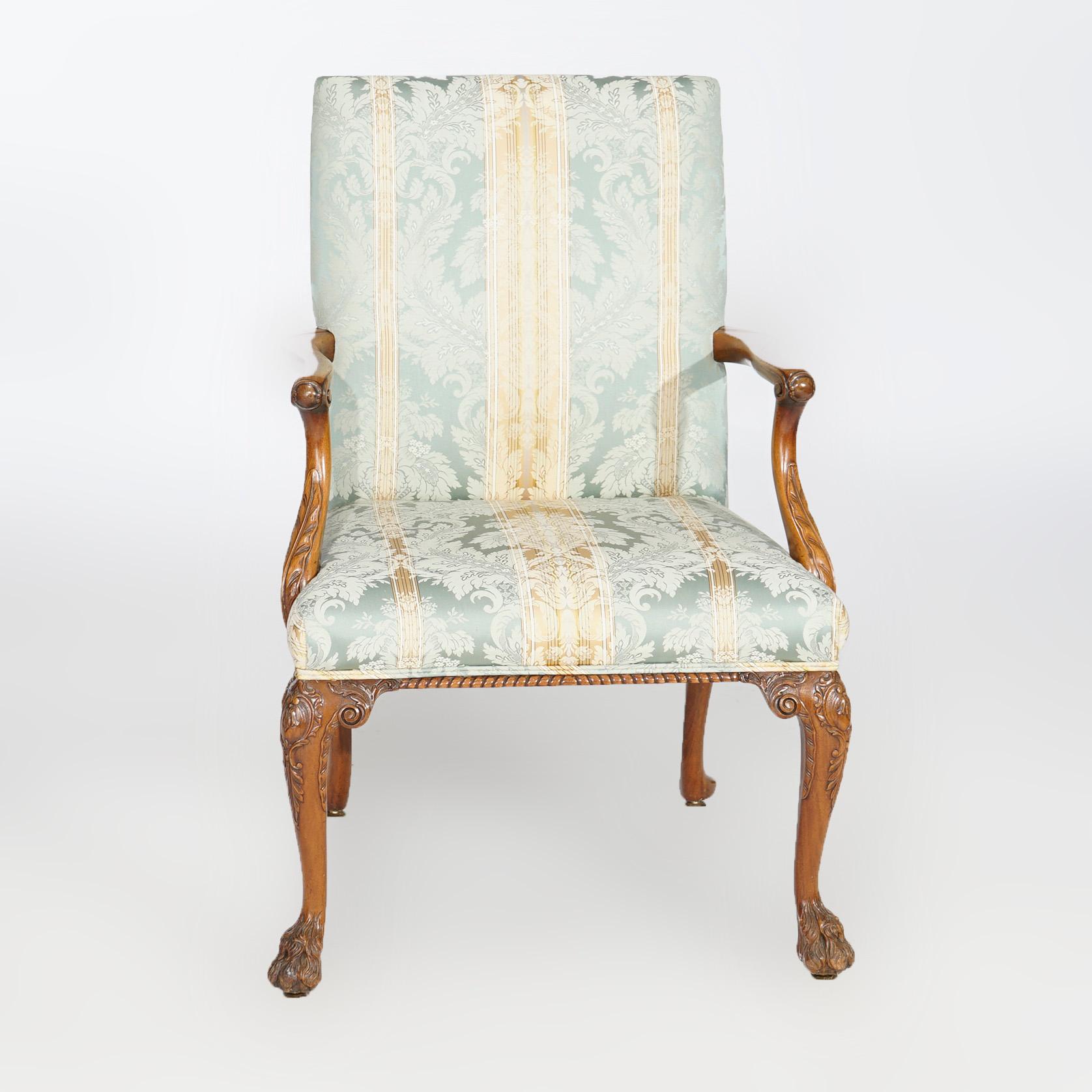 An antique English lolling chair offers upholstered seat and square back on walnut frame with scroll form arms, carved knees and hairy paw feet, 19th century

Measures- 39''H x 27.25''W x 27''D.

Catalogue Note: Ask about DISCOUNTED DELIVERY RATES