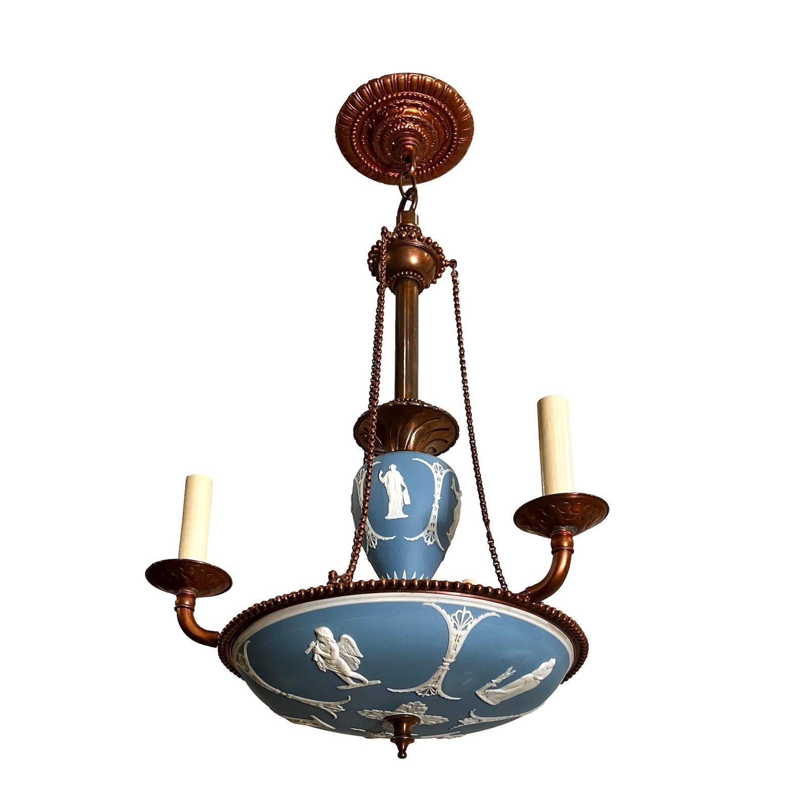 A circa 1900 English copper chandelier with Wedgwood porcelain plaques.

Measurements:
Drop: 26