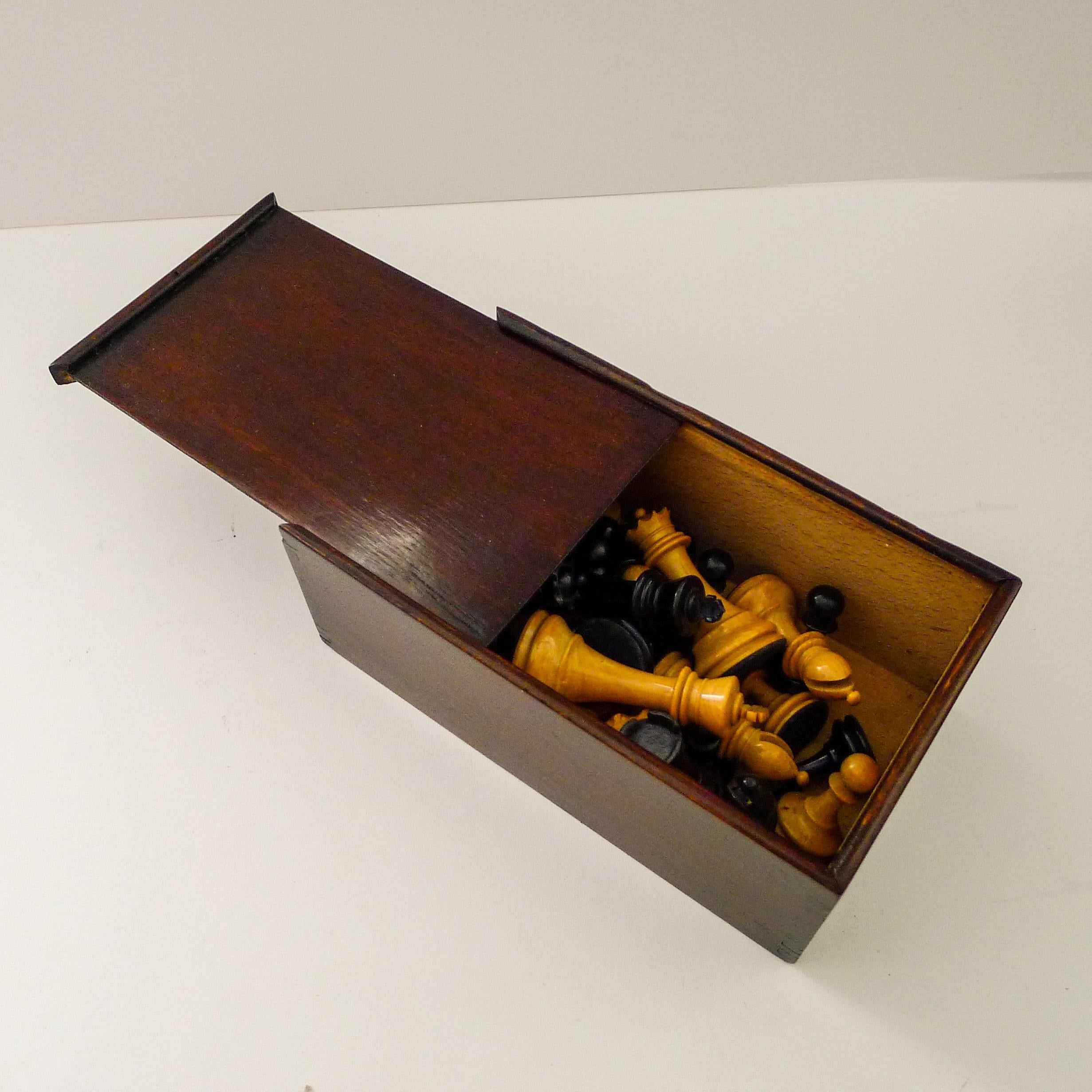 A good antique English chess set dating to c.1920 in excellent condition with minor wear commensurate with age and use, one fine hairline.

The king measuring 3 1/8