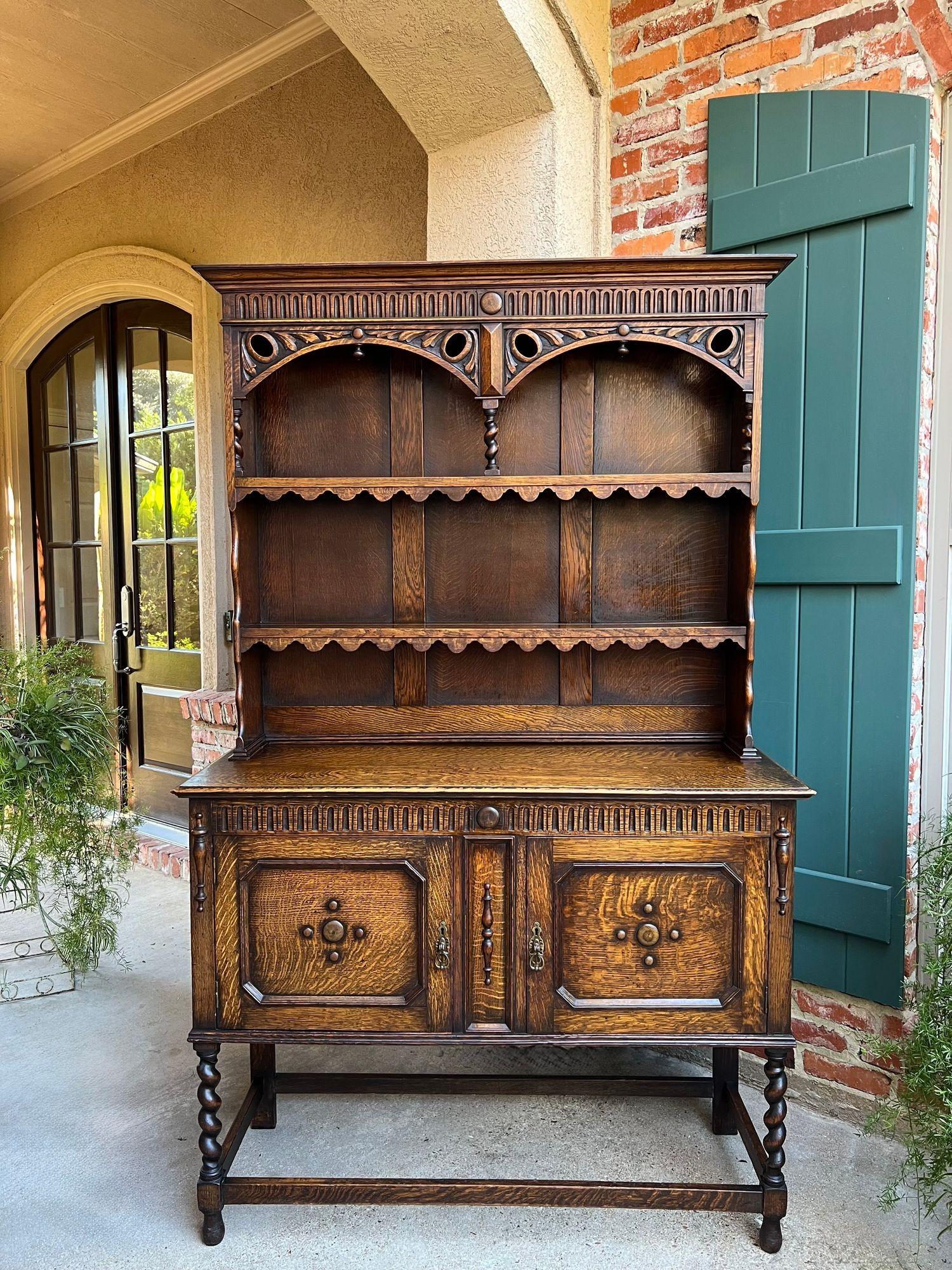Antique English Welsh Dresser Sideboard Barley Twist Carved Tiger Oak Farmhouse.

Direct from England, a gorgeous antique English “Welsh dresser” or sideboard, showcasing exceptional craftsmanship and richly carved details.

This dresser is a large