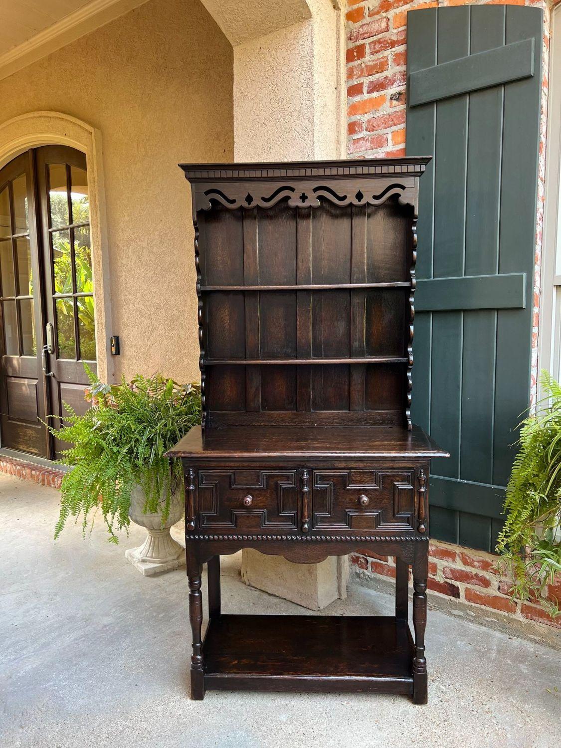 Antique English Welsh Dresser Sideboard Carved Oak Jacobean Farmhouse Cabinet.

Direct from England, a charming antique English “Welsh Dresser” or sideboard, ALWAYS a classic that blends perfectly with every style, and provides an abundance of