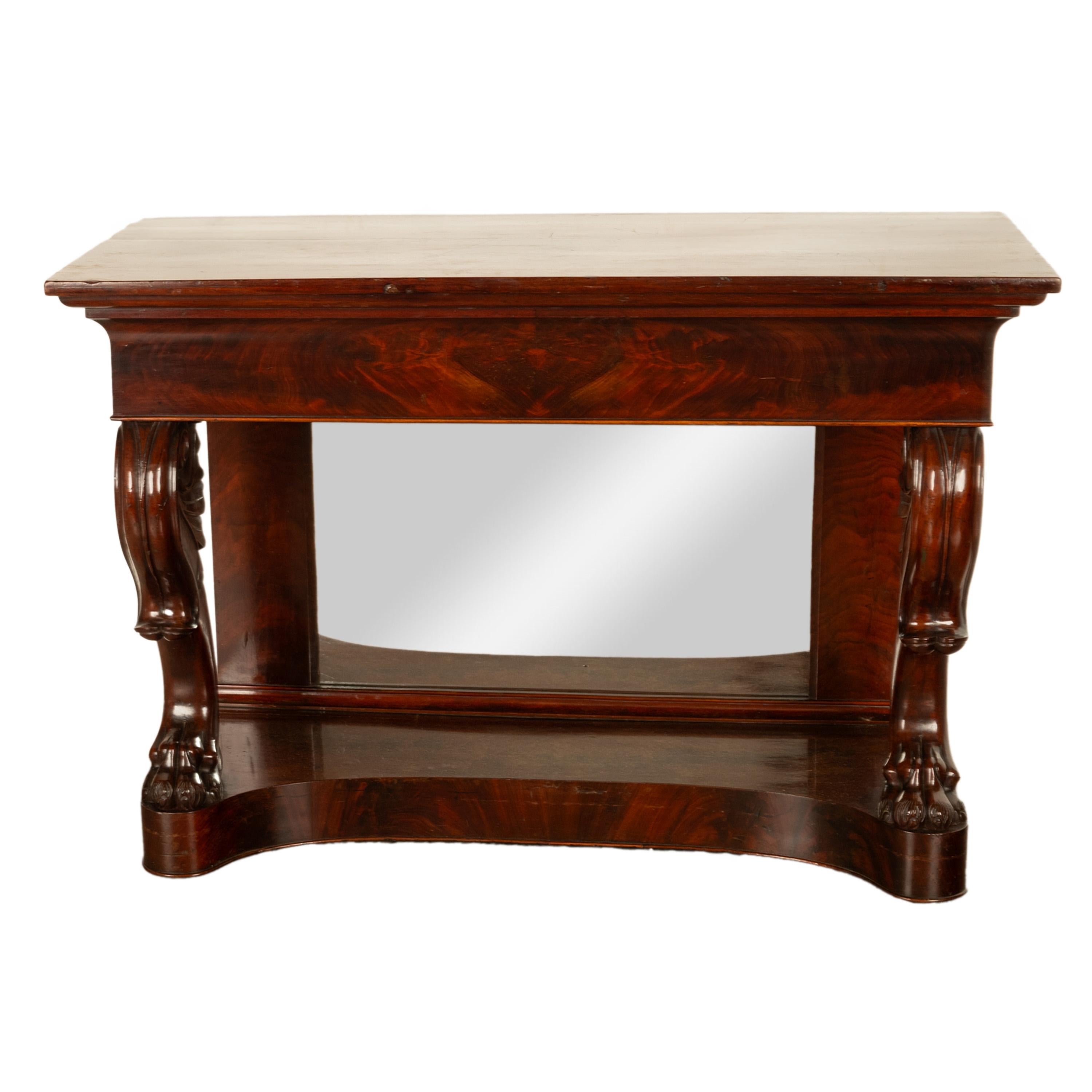 A fine antique English William IV Empire style flame mahogany mirror back pier, console table circa 1830.
The table is made from fine figured flame mahogany with a stepped & gently carved top, raised on substantial & boldly carved cabriole legs with