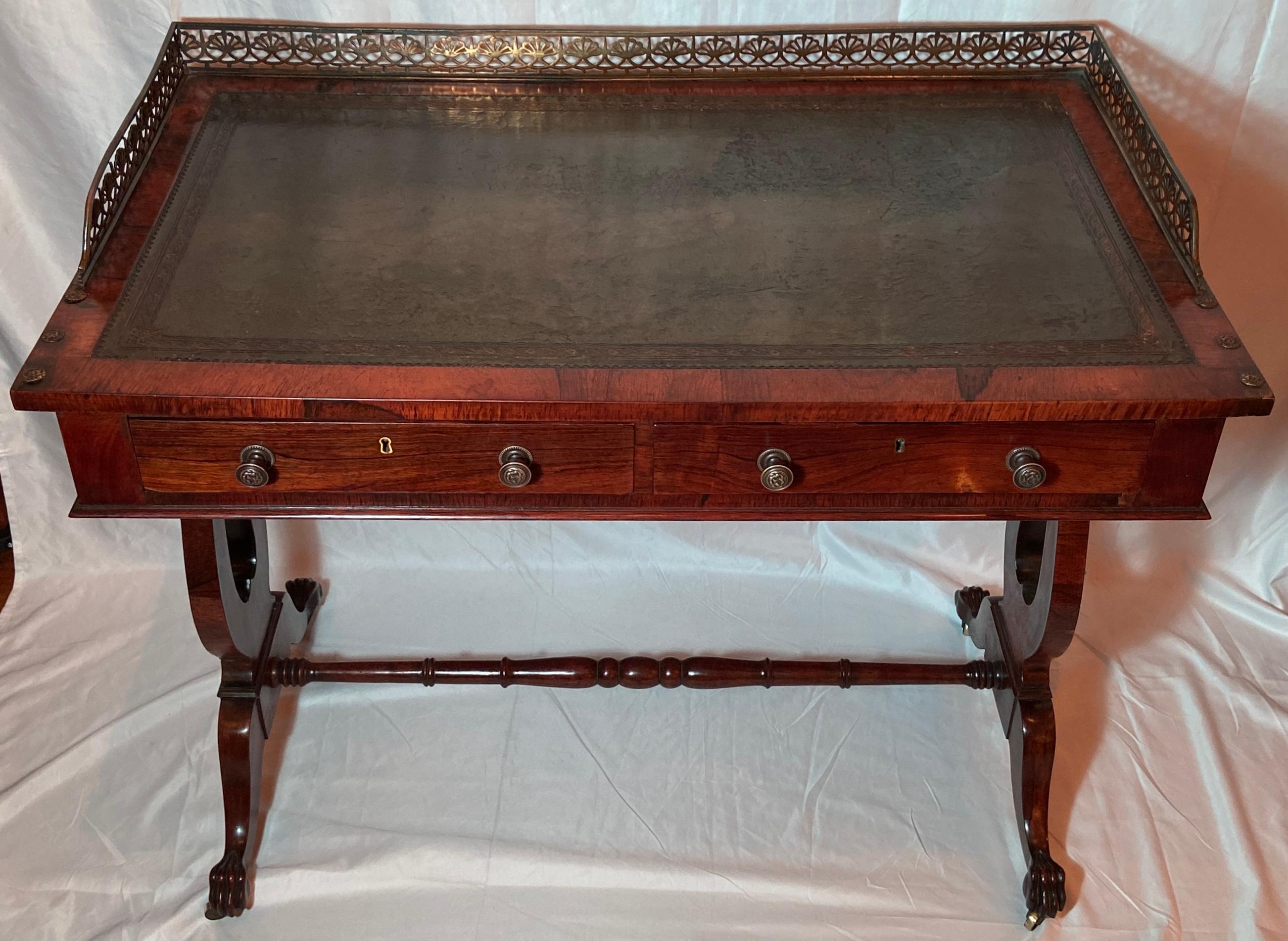 Antique English William IV period rosewood writing table, Circa 1830.
Galleried top with leather and on original casters.