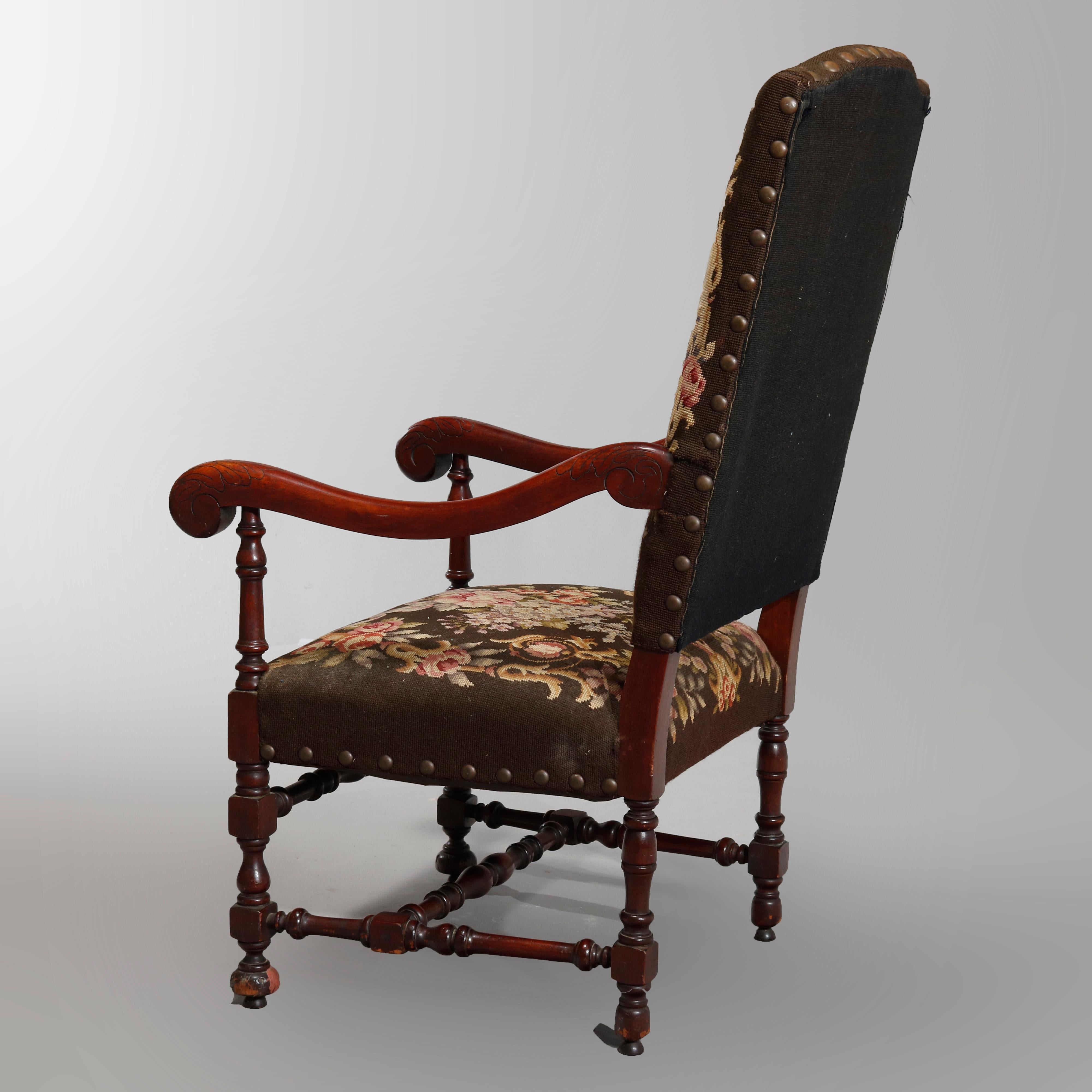 An antique English William and Mary tall back throne chair offers mahogany frame, shaped back with needlepoint upholstery having central courting scene, scroll form arms surmounting needlepoint seat raised on balustrade legs, circa 1900

Measures-