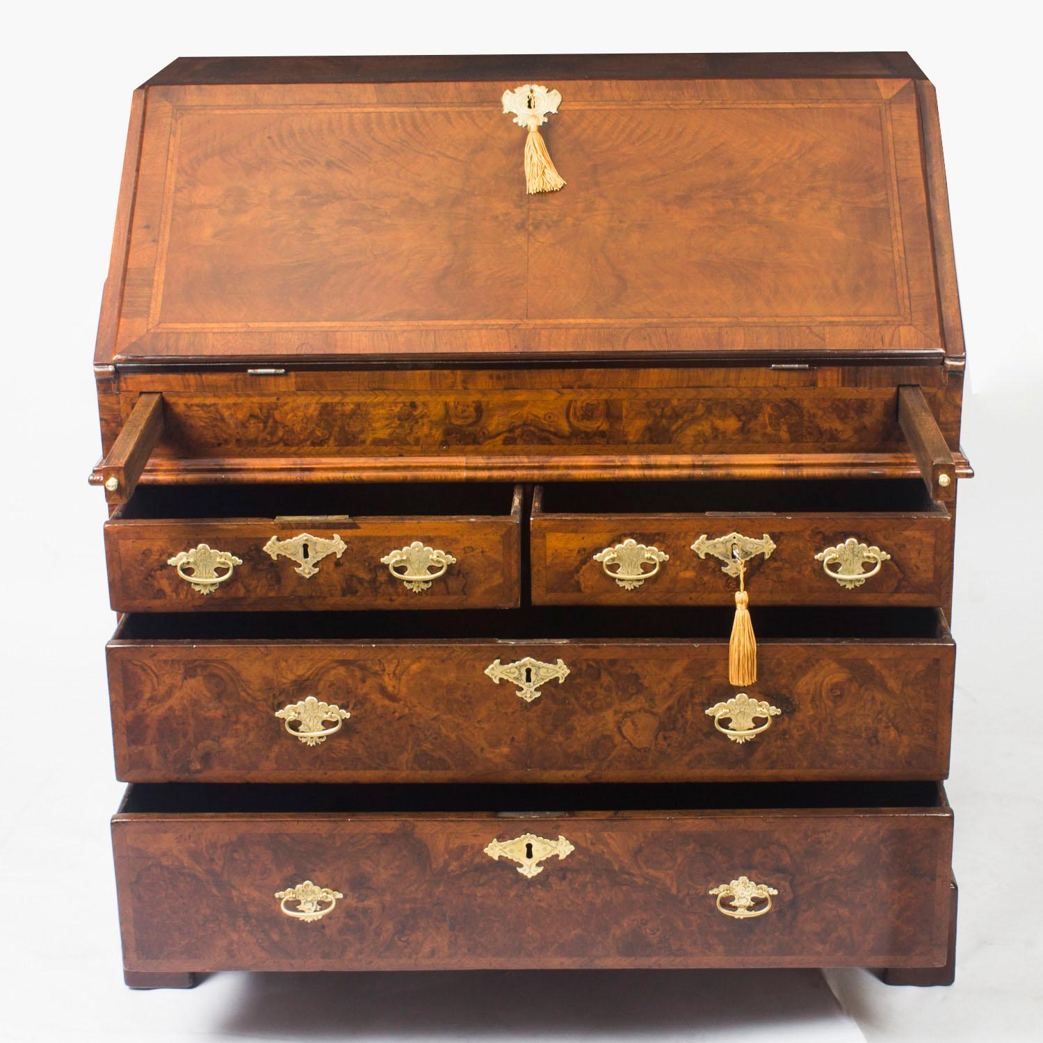 A stunning 17th century William & Mary burr walnut and feather banded bureau, circa 1690 in date.

The hinged fall enclosing a fitted stepped interior with four small drawers and a central cupboard, secret compartments and a well with a sliding