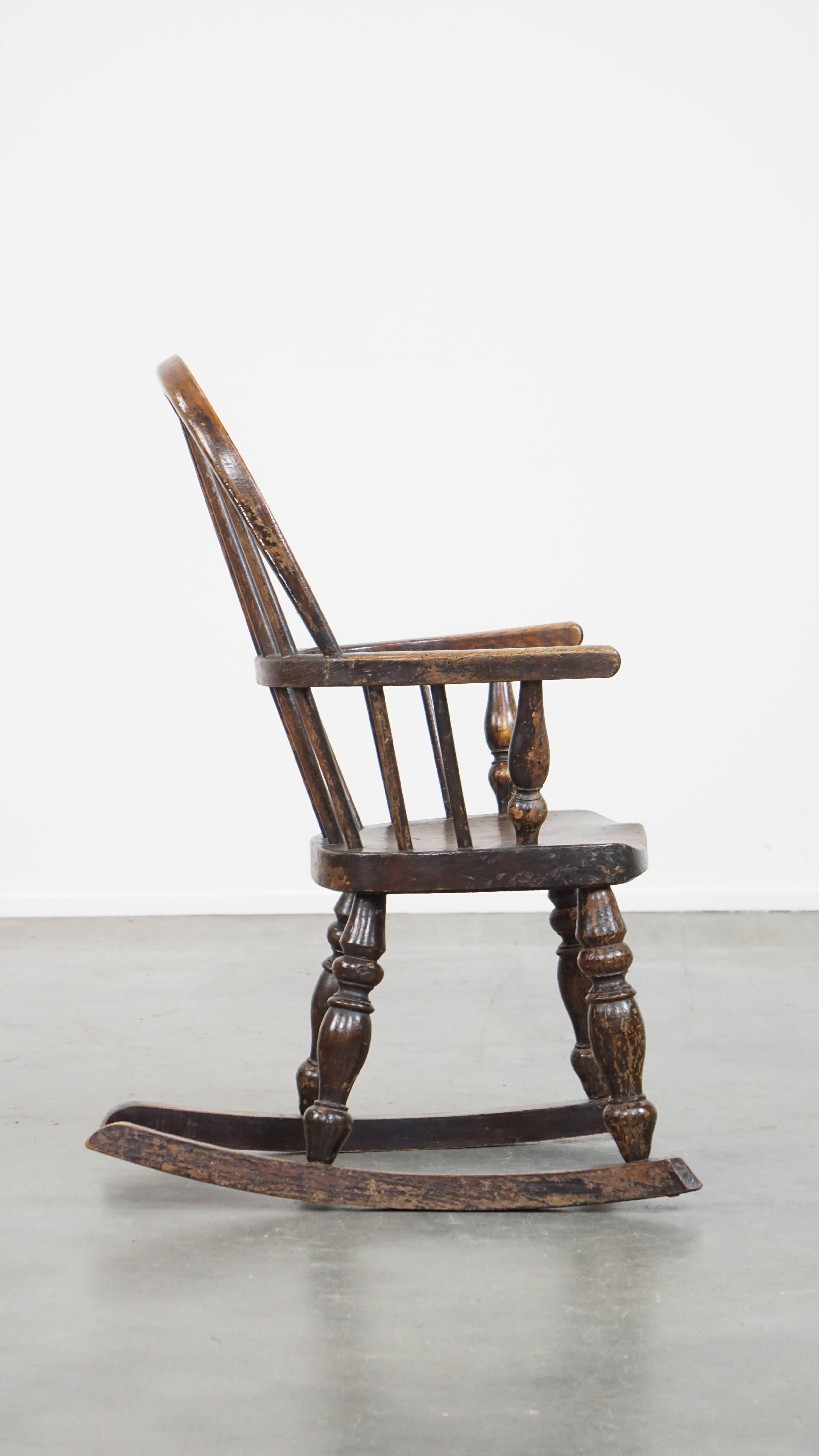Hand-Crafted Antique English Windsor children's rocking chair from the early 19th century For Sale