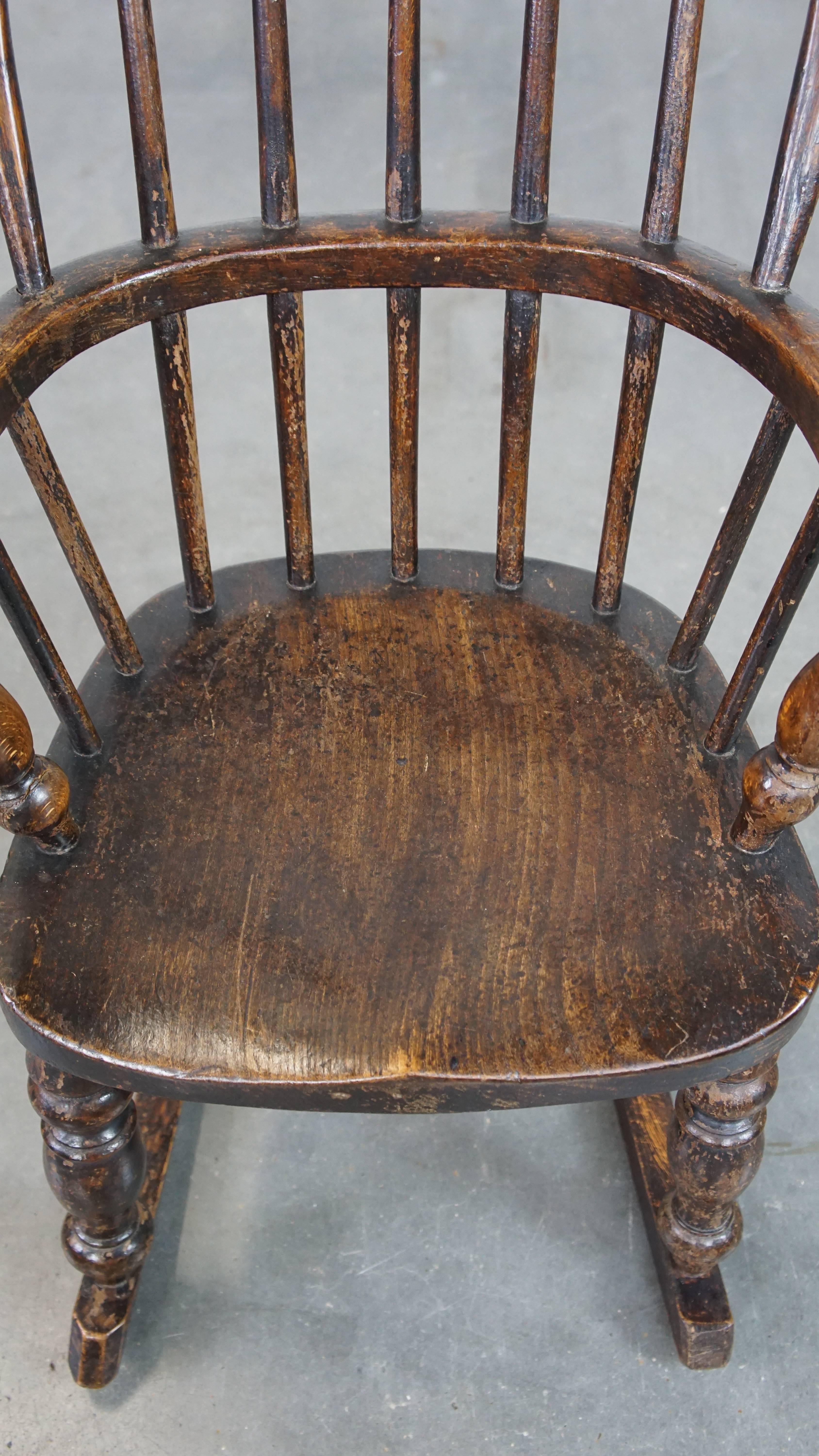 Wood Antique English Windsor children's rocking chair from the early 19th century For Sale