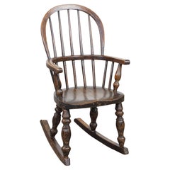 Antique English Windsor children's rocking chair from the early 19th century