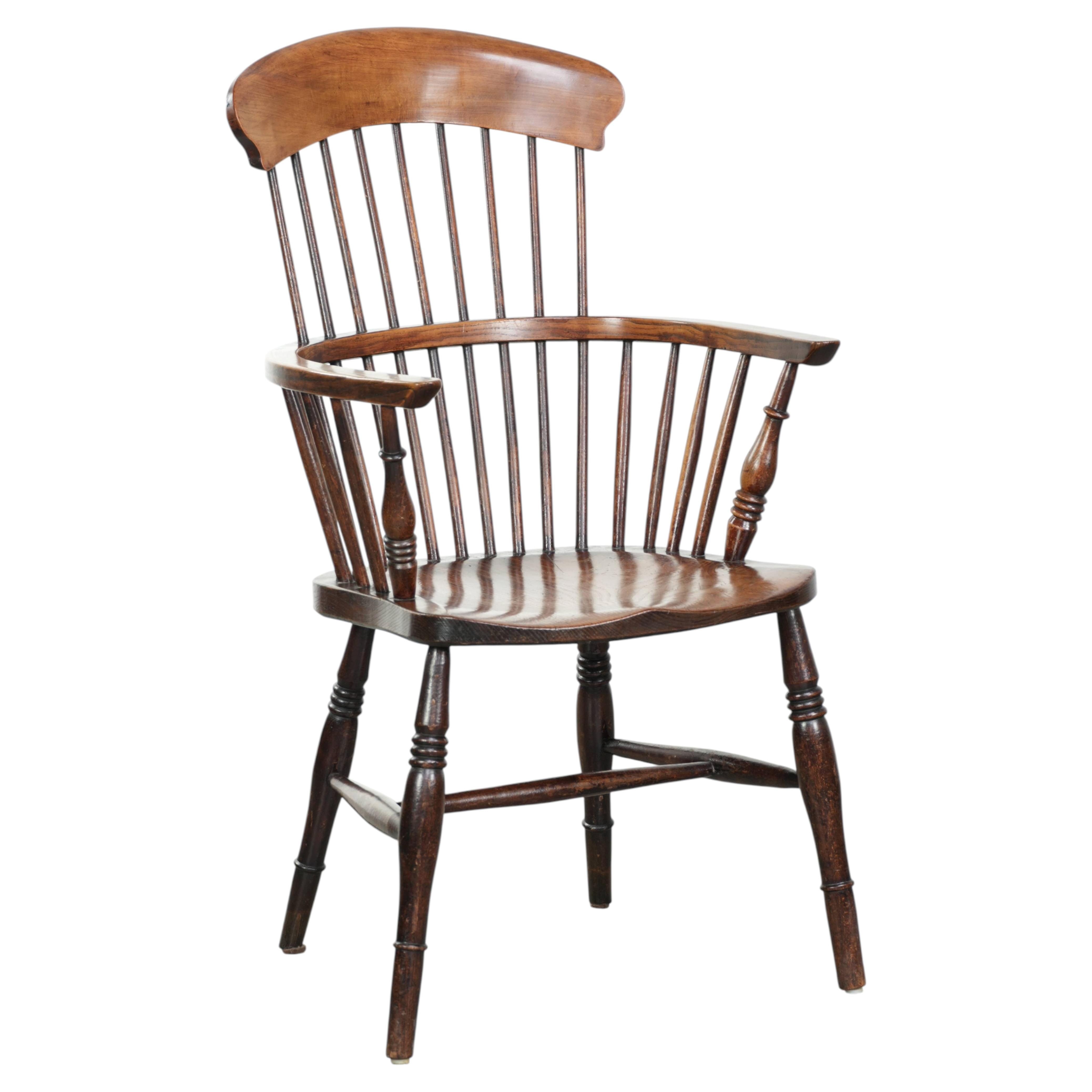Antique English Windsor highback chair from the 19th century For Sale