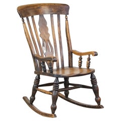 Antique English Windsor rocking chair with a beautiful and pure patina