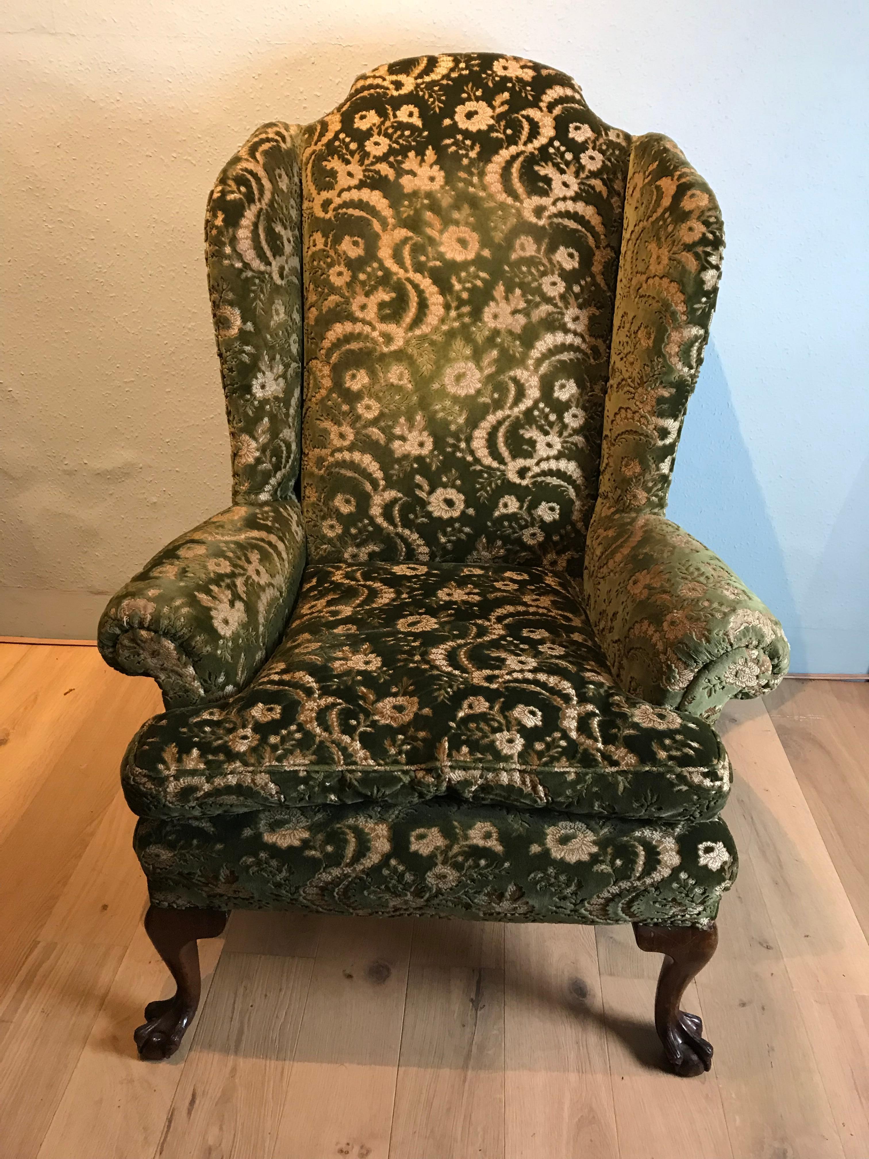 Country house Queen Anne style walnut armchair of large scale in very good condition with elegant scroll top cresting rail and arms resting on boldly carved ball and claw cabriole legs circa 1900.
