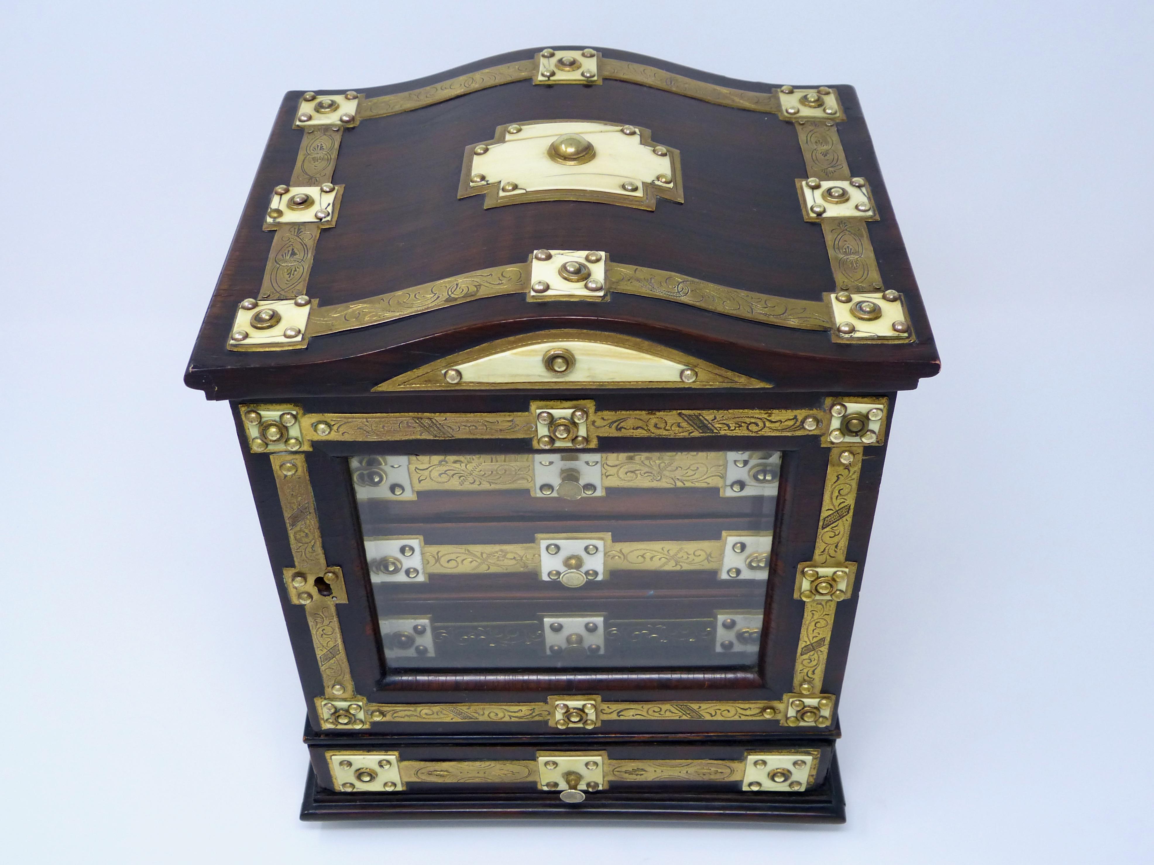 Antique wood, bronze and ivory jewelry box
Made in England in 1890s
Comes with original working key
Has some minor losses and torn fabric inside of one of the drawers.