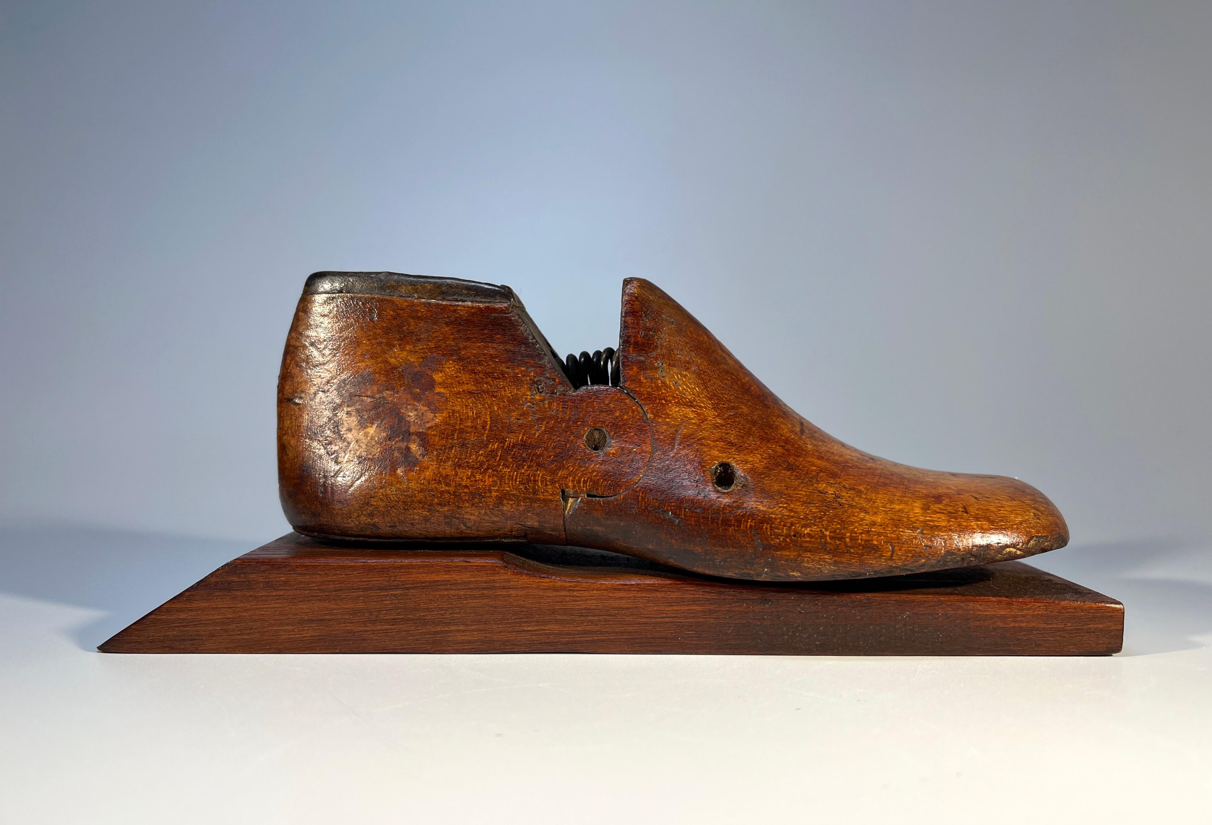 Delightful curiosity of a child's English wooden shoe mold size 8, mounted as a paperweight
Wonderful aged scarring, a rich patina and form from a bygone era
Circa mid 1900's
Height 3 inch, Width 8 inch, Depth 2.25 inch
In good condition
Wear