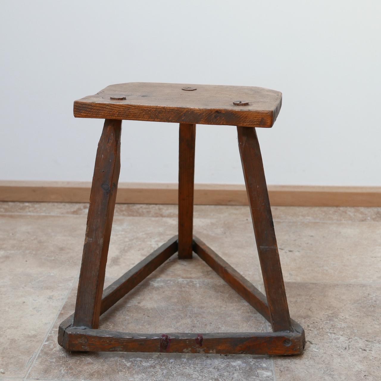 An antique wooden cutler's stool salvaged from Birmingham's Jewellery quarter.

England, late 19th century.

Originally used as a stool but ideal as a naive side table.

These stools look as good in an antique setting as well as a modern or