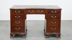 Antique English wooden desk from the late 19th century with a leather top
