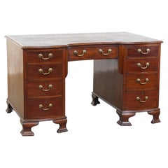 Antique English wooden desk from the late 19th century with a leather top