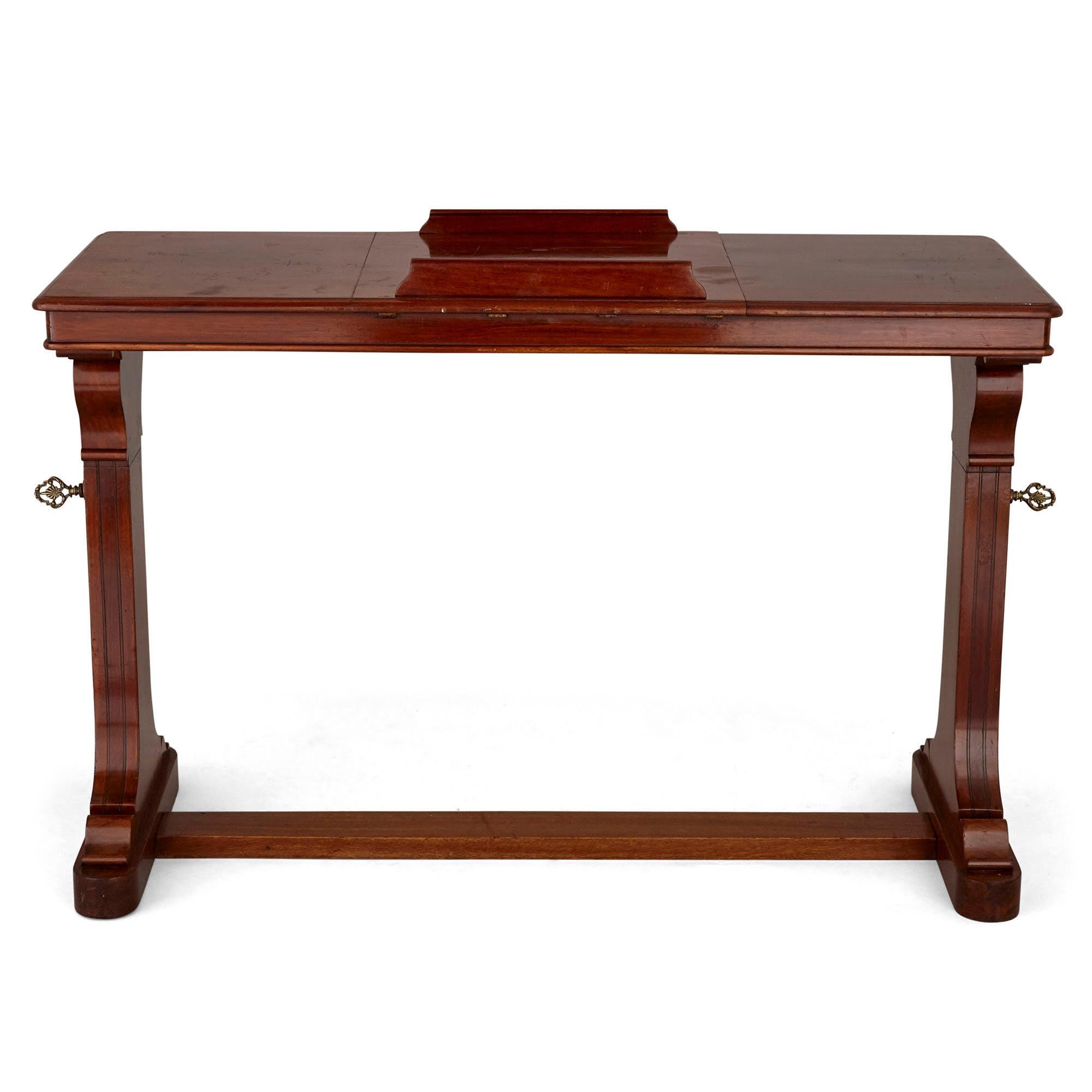 Antique English wooden desk with reading stand

Beautifully carved from wood, this Victorian English reading desk is supported by two legs with scrolled column-like profiles, with both legs joined by a central stretcher bar. The legs are