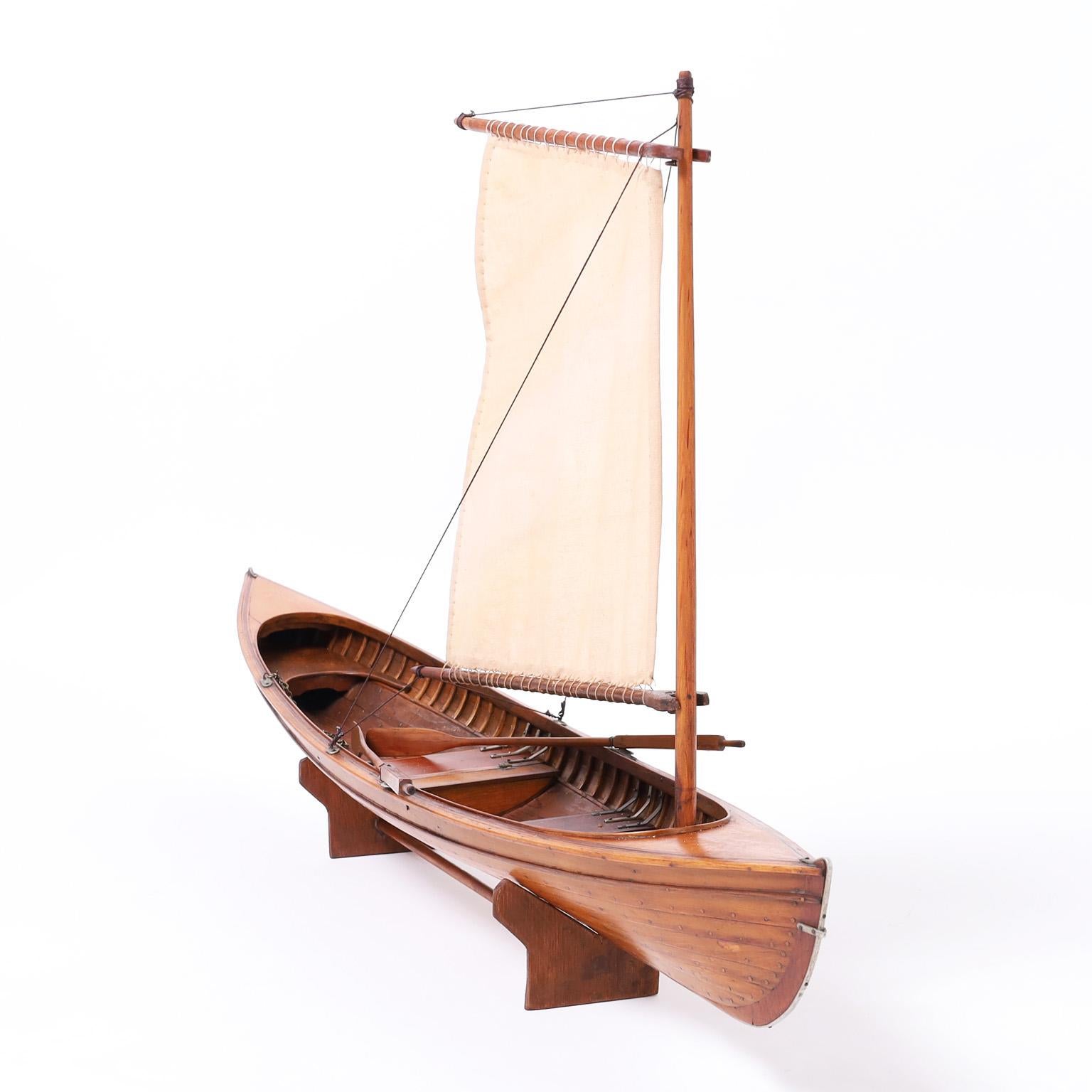 Lofty antique English Edwardian Thames river rowing skiff model with sale, hand crafted in mahogany with ambitious accuracy. Presented on a hand crafted wood base.