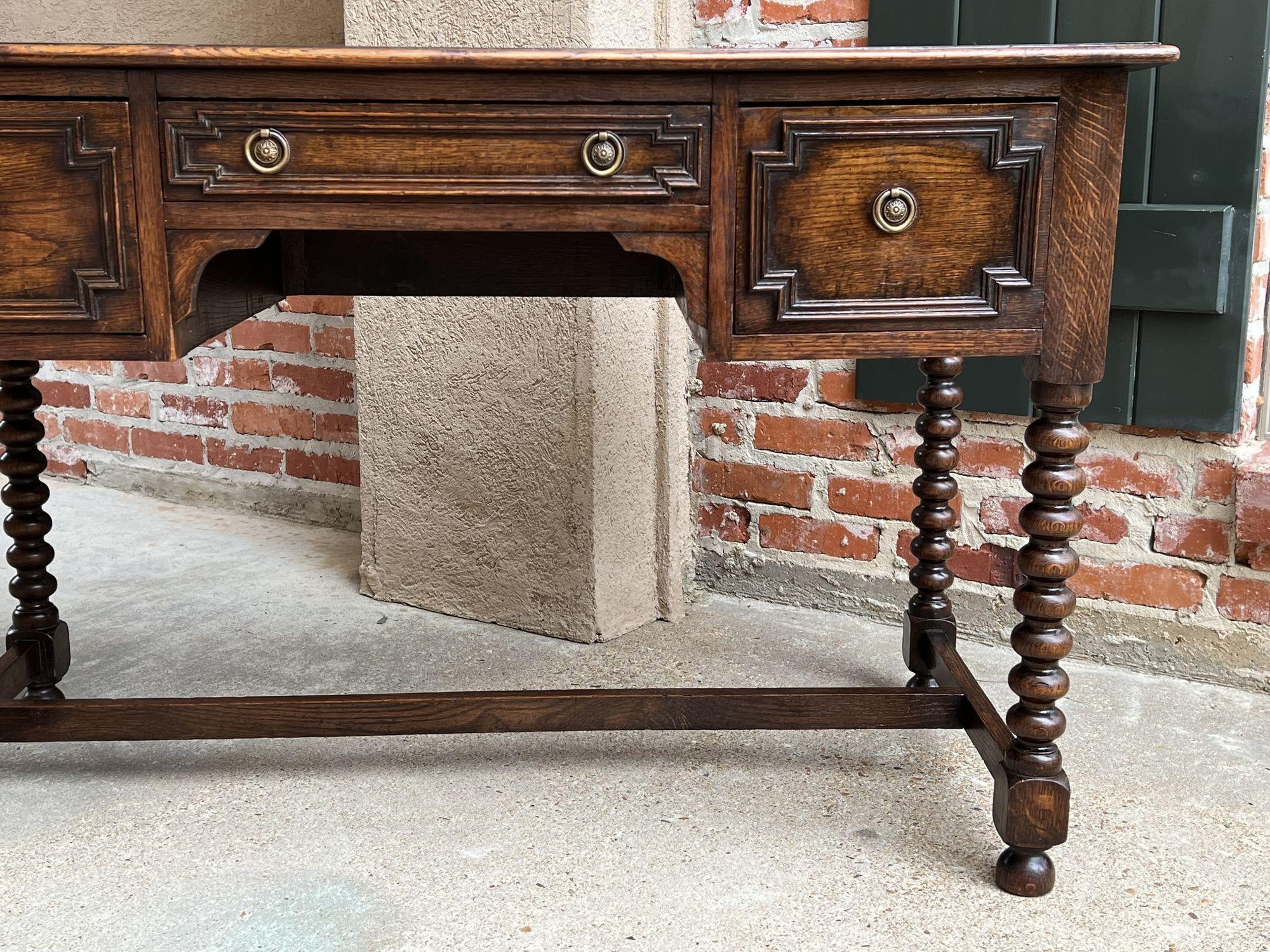 20th Century Antique English Writing Desk Table Jacobean Carved Oak Green Leather Bobbin Leg