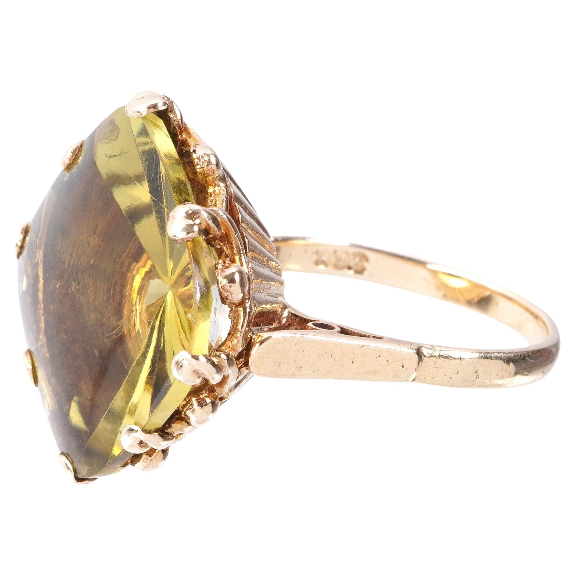 Antique English 9K yellow gold ring with citrine stone. Stone is approximately 18mm x 18mm x 9mm. 10 grams total weight. Ring has maker's mark and the numbers 9 375 on reverse side along with hallmark.