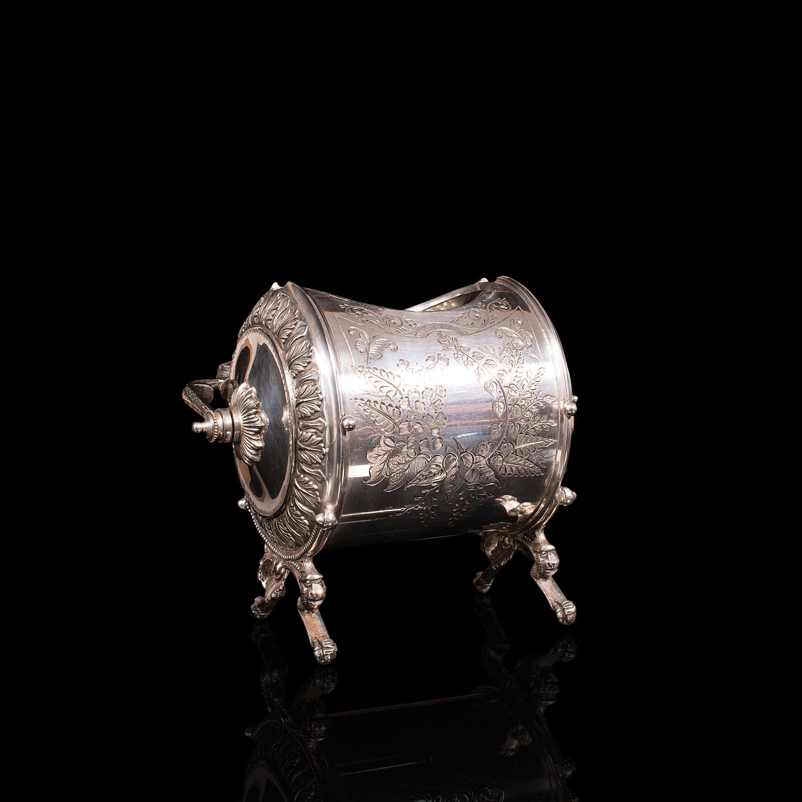 This is an antique engraved biscuit barrel. An English, silver plated decorative jar, dating to the early Victorian period, circa 1860.

Strikingly decorated and wonderfully fascinating
Displays a desirable aged patina and in good order
Bright