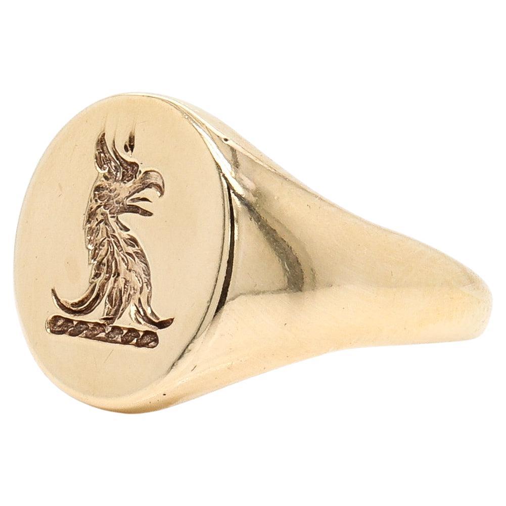 Anello sigillo d'oro antico inciso con stemma raffigurante una testa di grifone