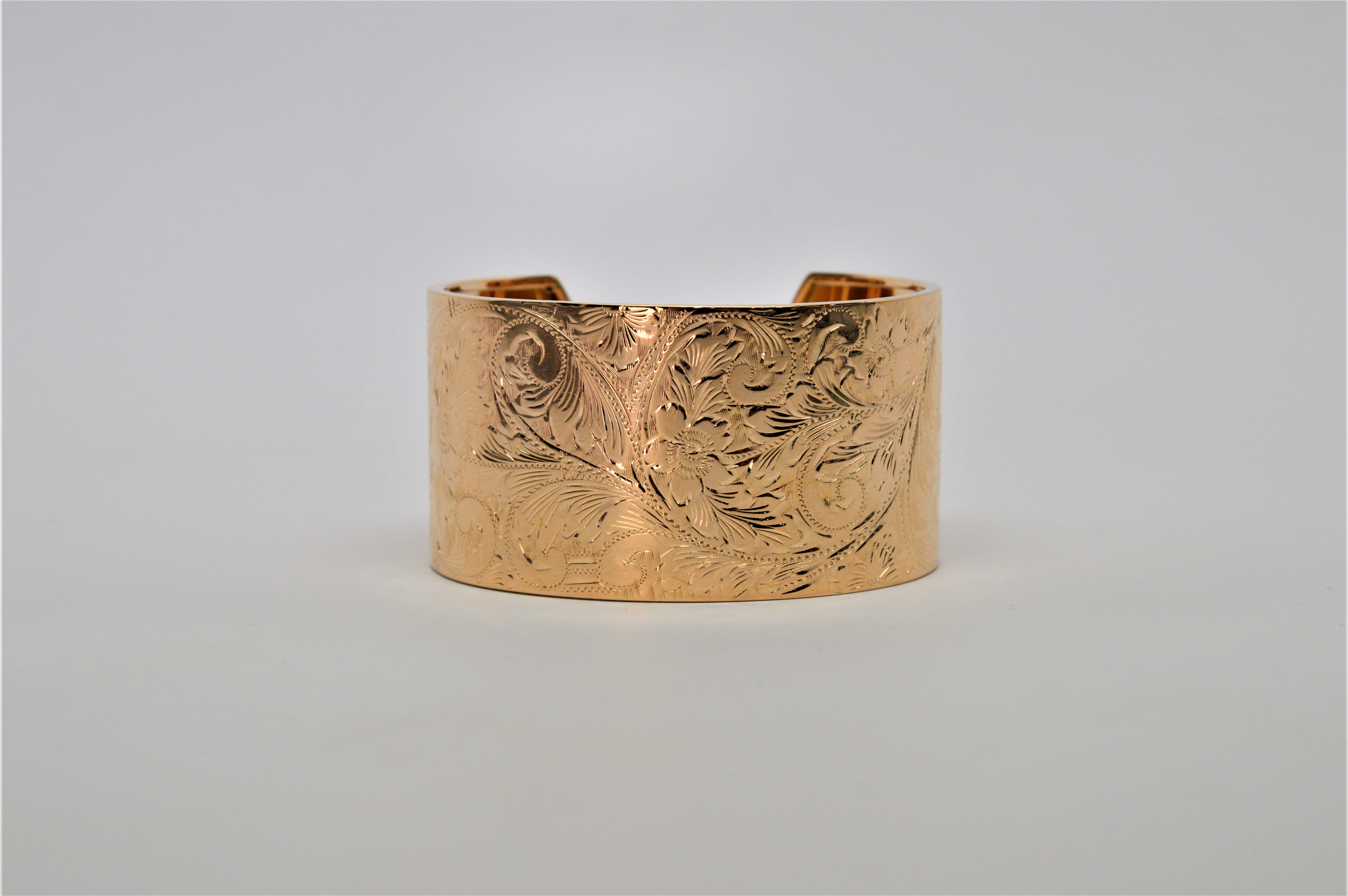 Hand Engraved Fine Antique 14K Yellow Gold Wide Cuff Bracelet. Restored with a highly polished finish showing off the vine and floral engraved artistry, this gorgeous gold cuff measures 2-1/4 inch. With a one inch opening in the back for easy on and