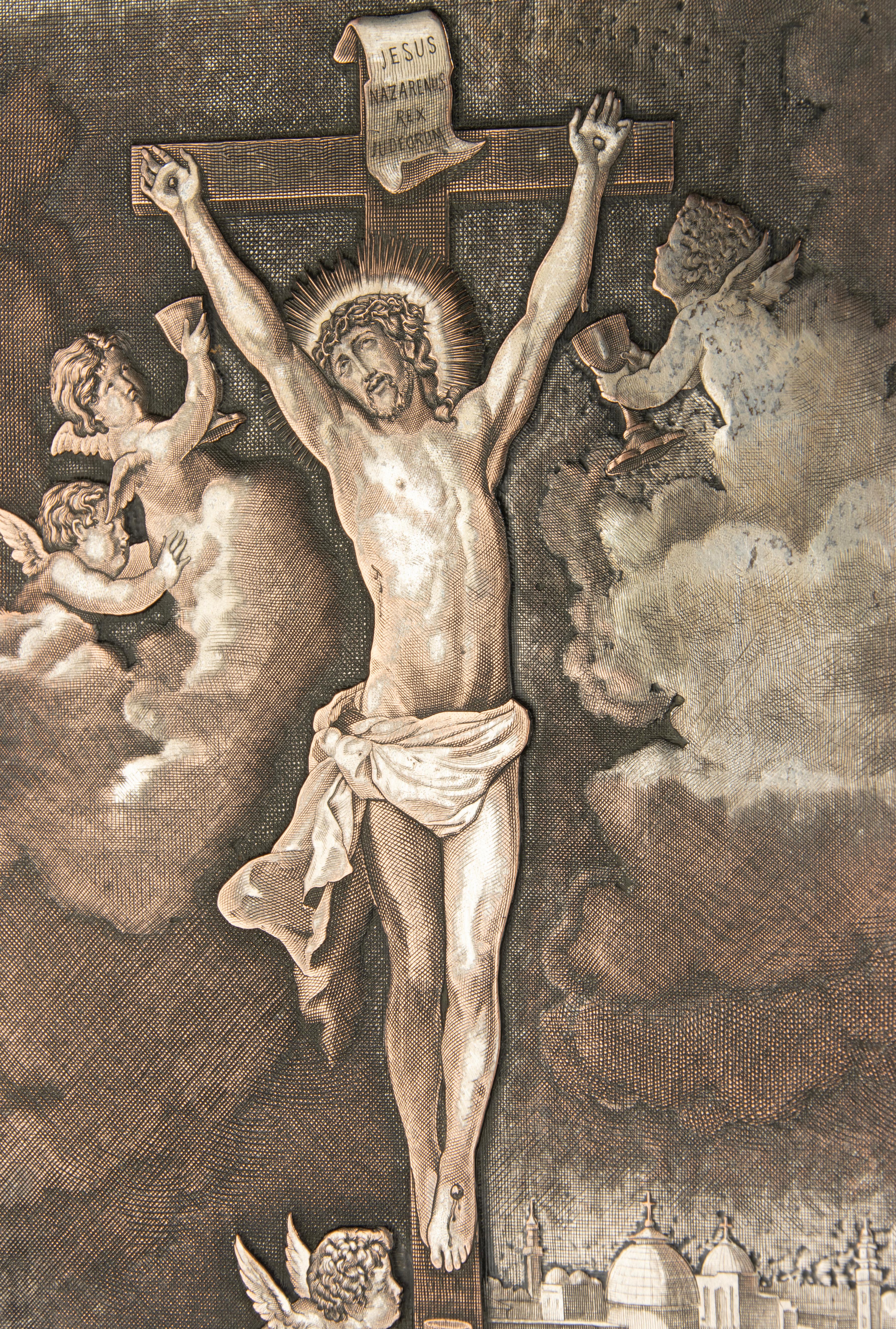 A late 19th century engraving, depicting the crucifixion of Jesus Christ and cherubs 