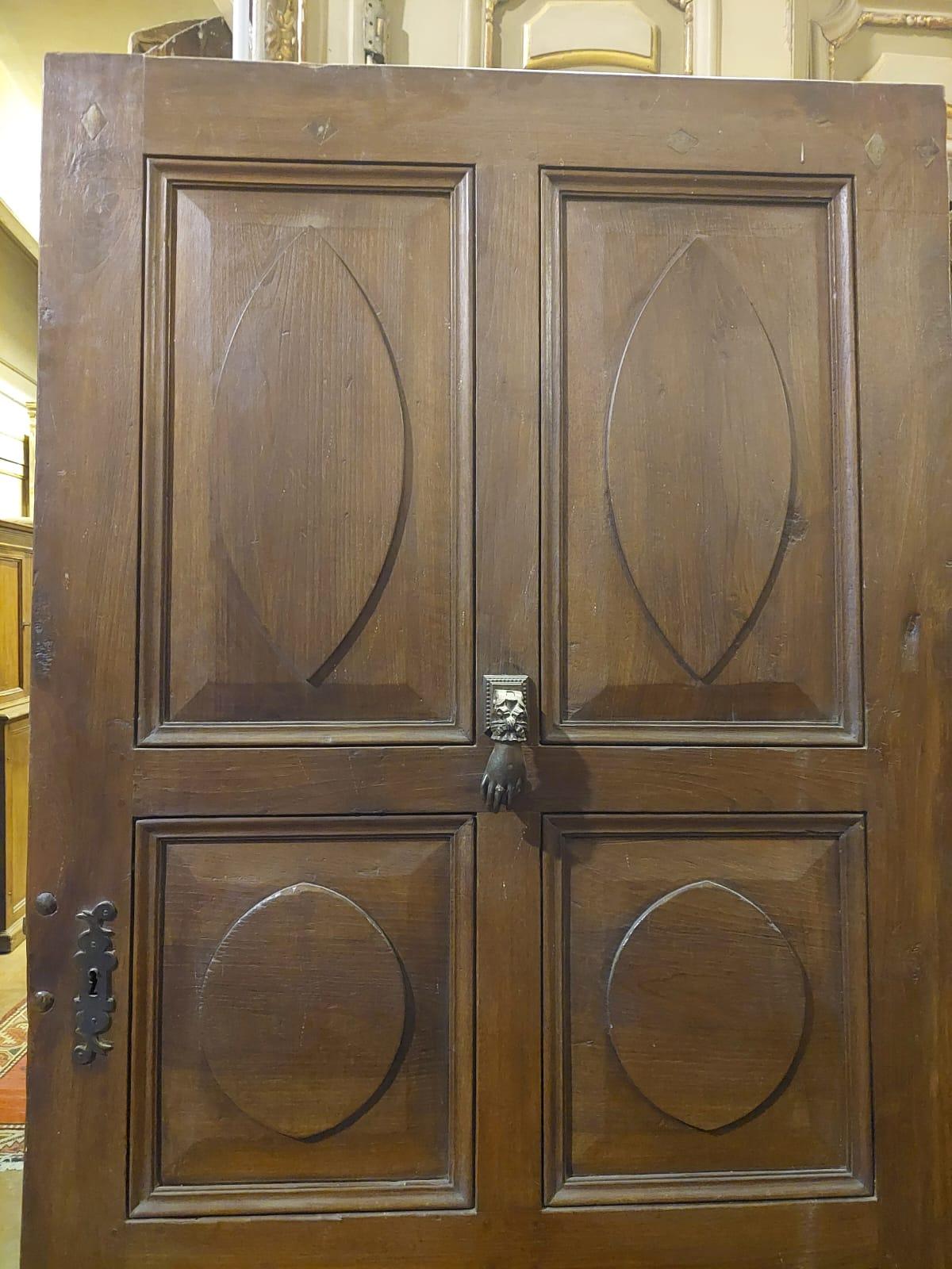 Antique entrance door, one-leaf main door, in hand-carved walnut with almond-shaped tiles typical of the time, hand-built in the first half of the 19th century for the entrance to a building in the historic center of Piedmont (Italy).
Ideal for a