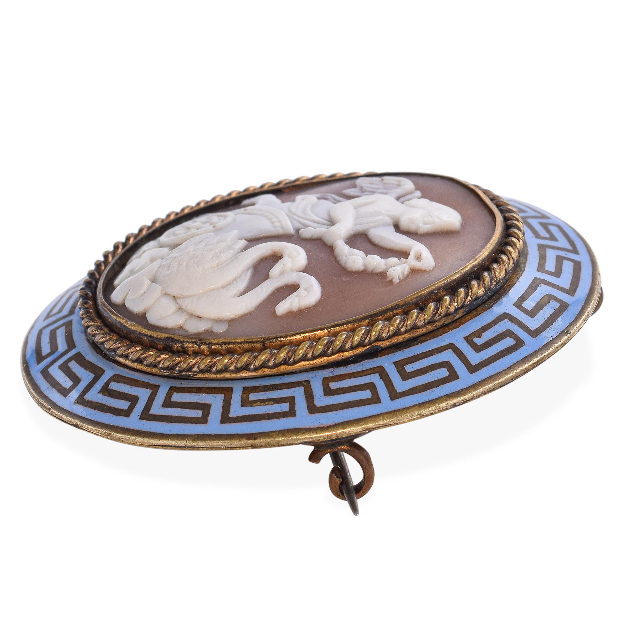 Romantic and finely carved, this antique brooch features a beautifully detailed shell cameo depicting Eros, the Greek god of love, accompanied by graceful swans—a classical symbol of beauty, fidelity, and transformation. The cameo is set in an